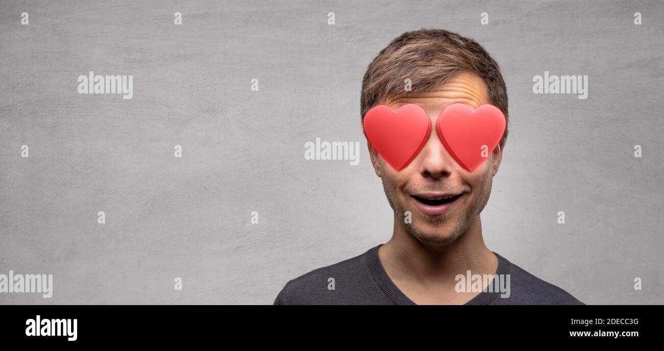 Man with heart shaped eyes Stock Photo