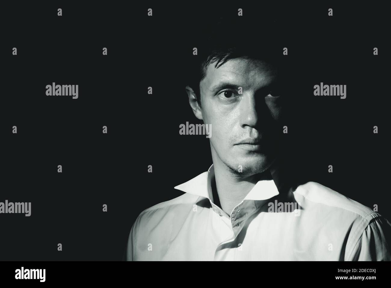 Middle aged man. Black and white dramatic portrait, low key Stock Photo