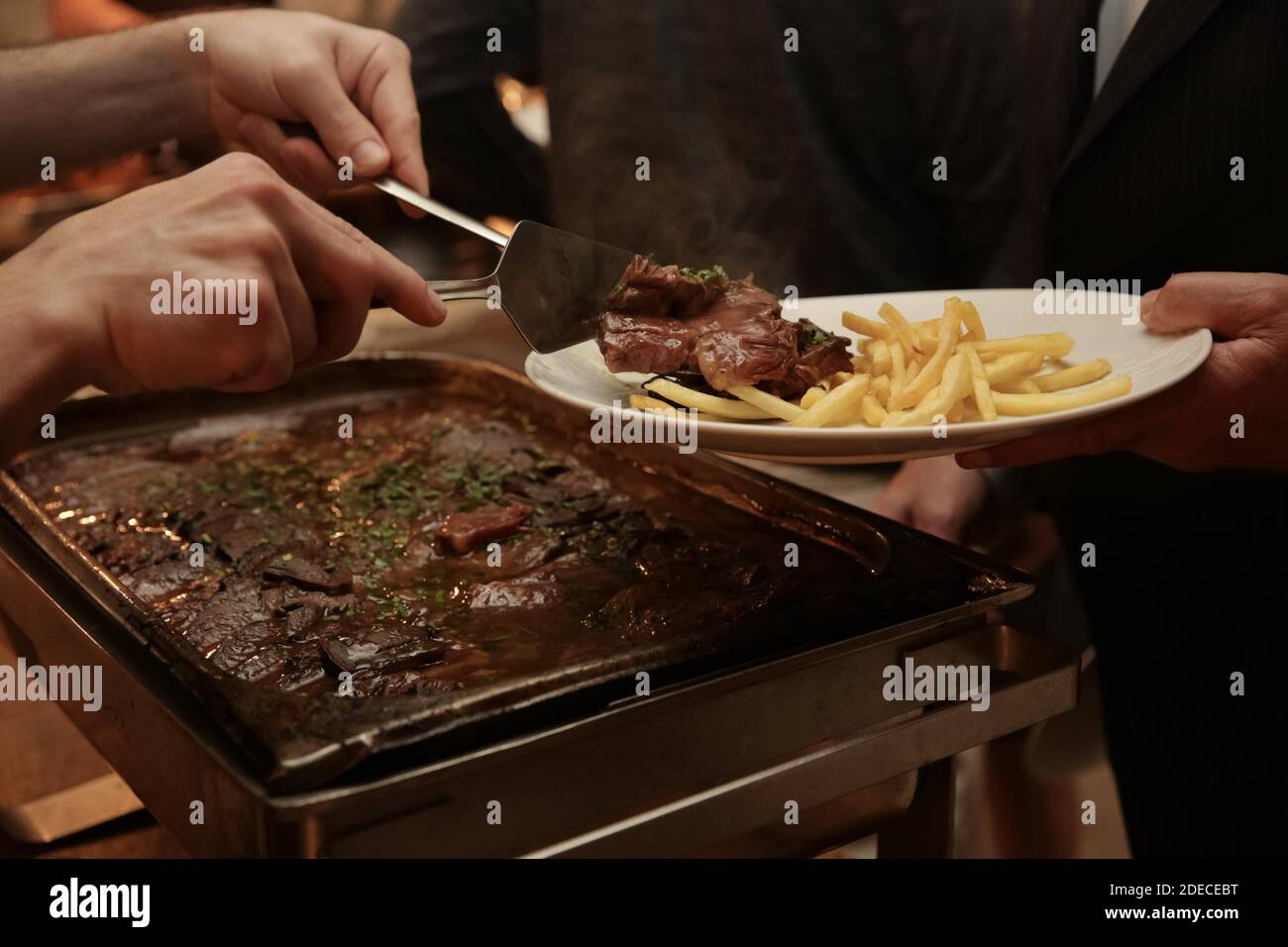 Preparing and serving Roast Beef at a buffet table Stock Photo Alamy