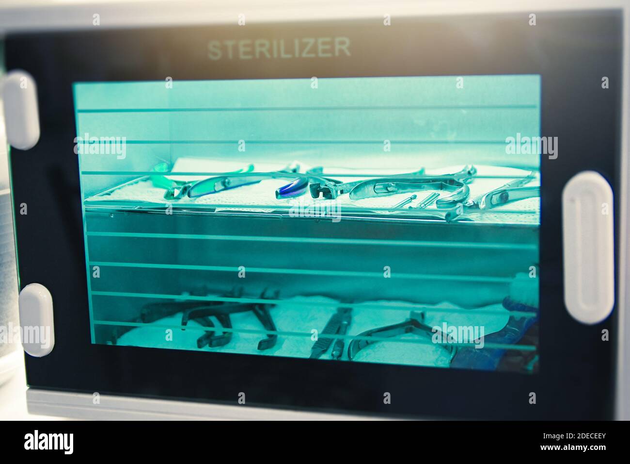 Manicure and pedicure instruments are sterilized in a special chamber. Stock Photo