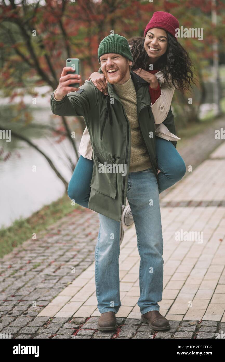 Man and woman making selfies during the date Stock Photo