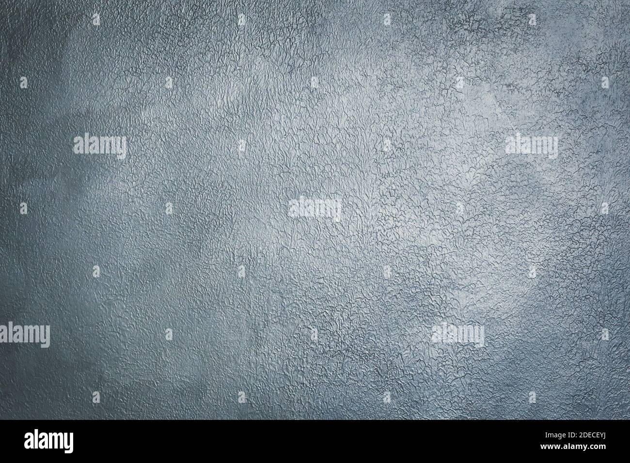 Grey textured decorative stucco for background with vignette. Stock Photo