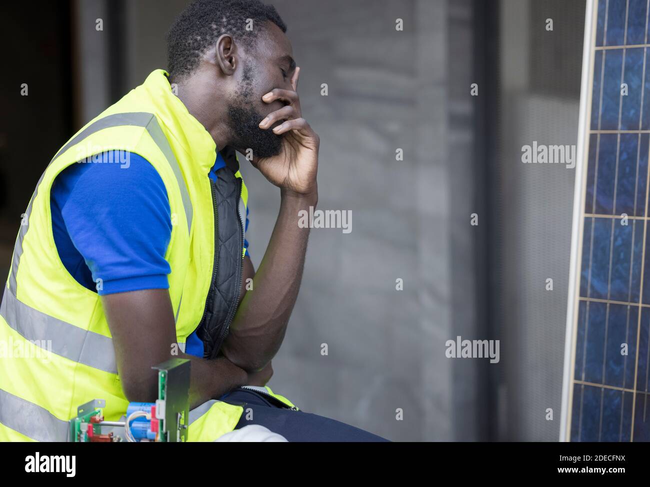 Engineer or architect holding hands at his head. He is having problems in work. Engineering concept. Stock Photo