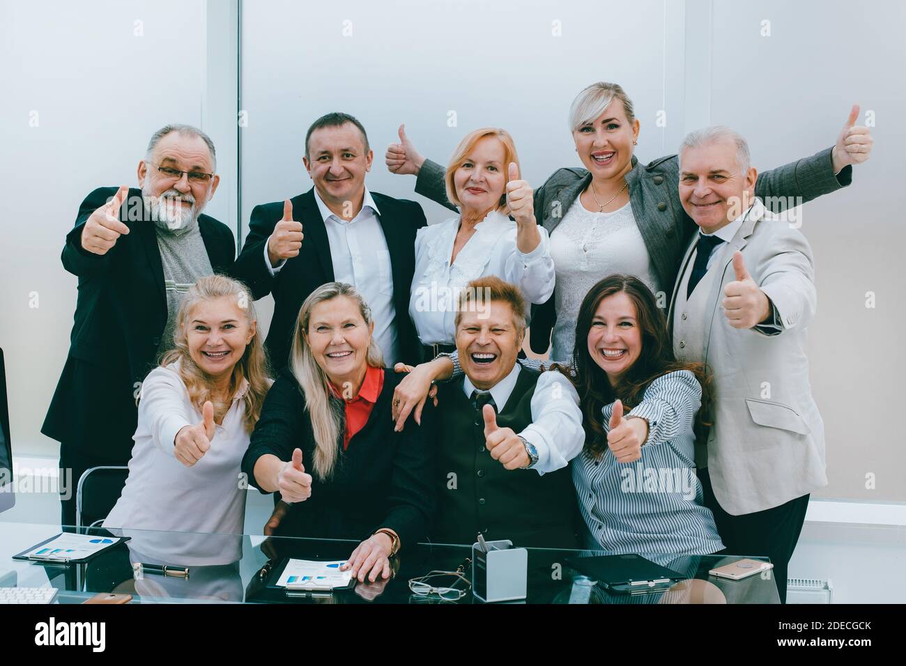 Employees showing thumbs up hi-res stock photography and images - Alamy