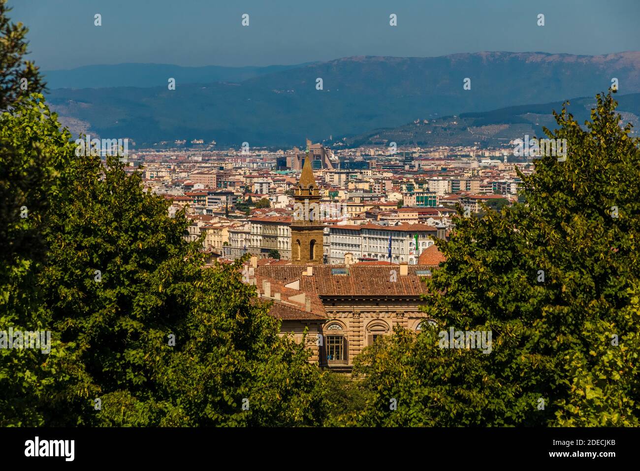 Splendid view from Boboli Gardens between two trees overlooking Florence. In the centre is the Palazzo Pitti and the bell tower of Basilica di Santo... Stock Photo