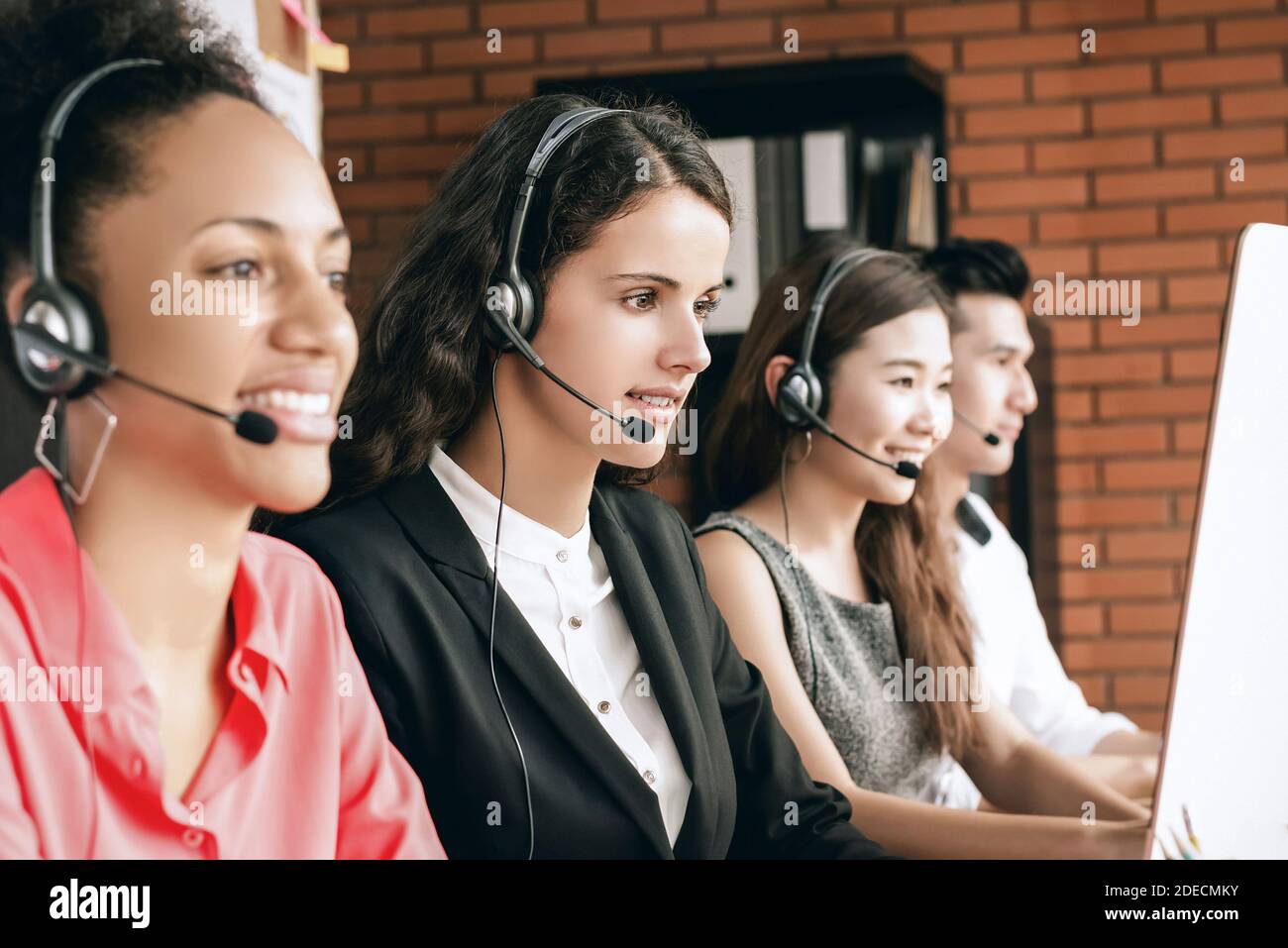 International call center telemarketing customer service agent team working in the office Stock Photo
