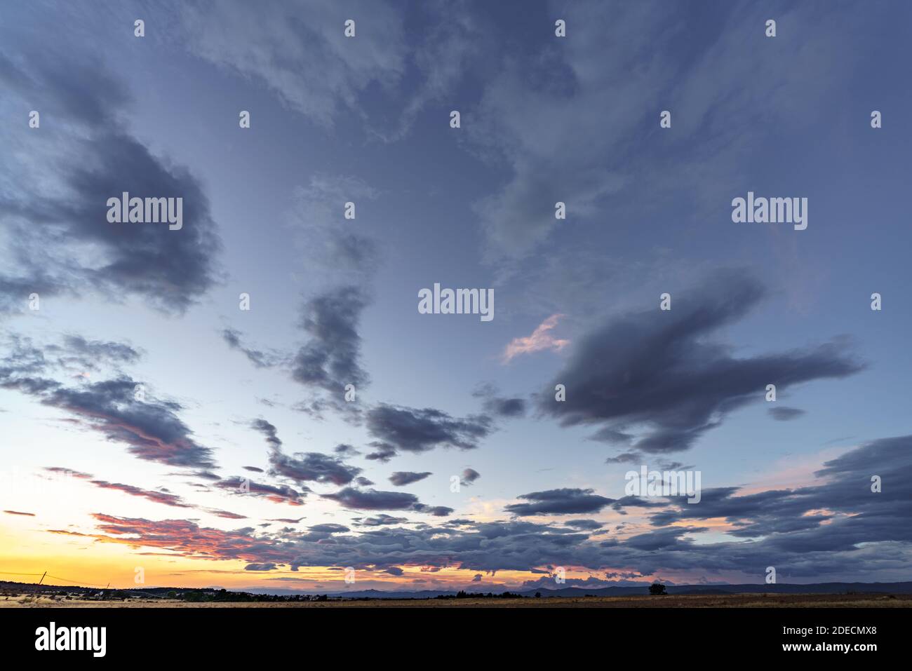 Sky background at sunset with blue clouds Stock Photo - Alamy