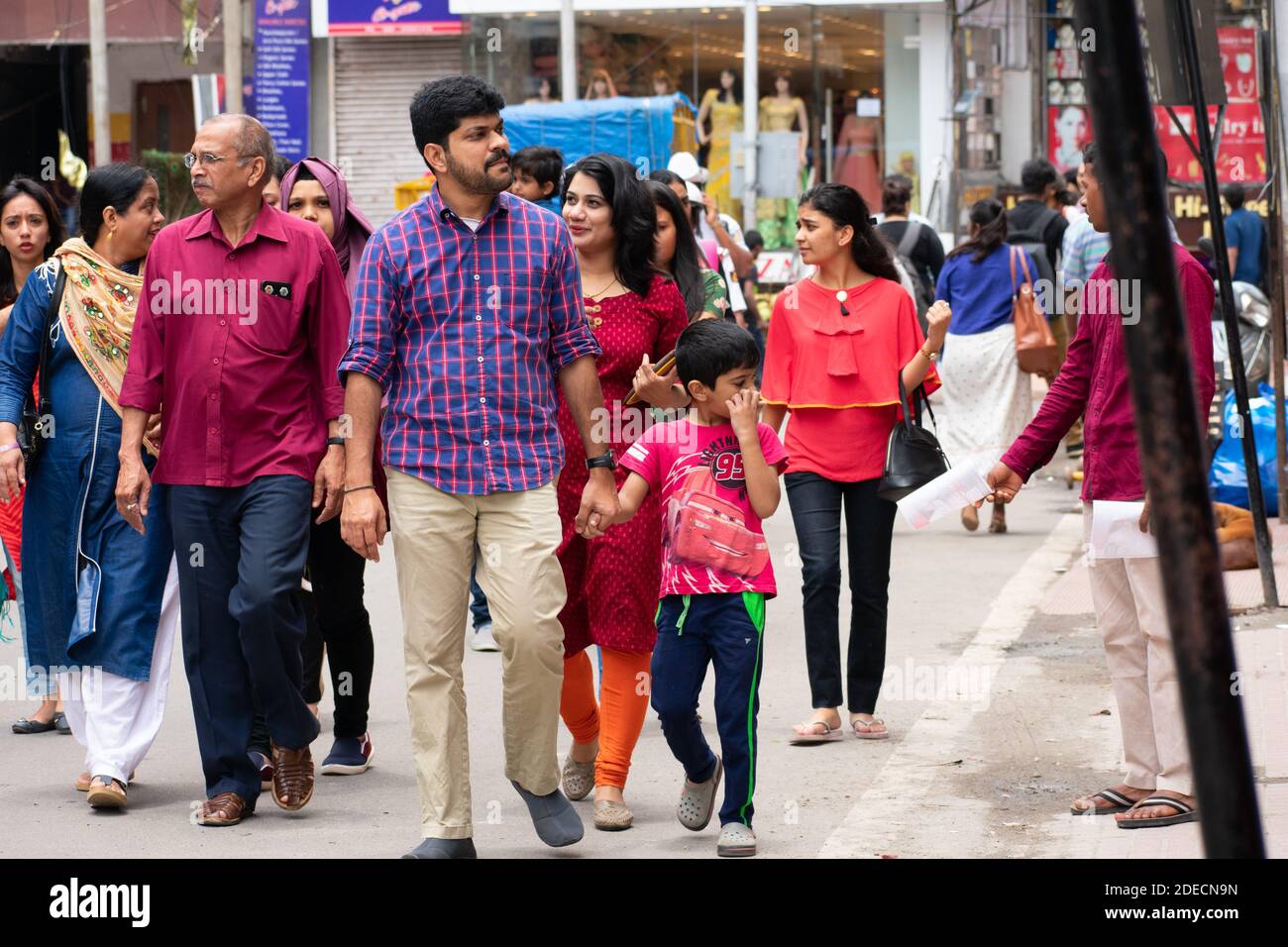 Bangalore, India - August 12, 2018: Indian family walks this morning at commercial street, a hotspot for shopping in the city. Stock Photo