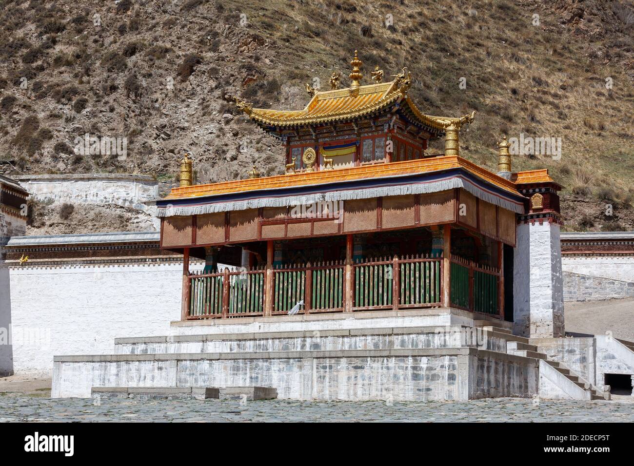 Xiahe, Gansu Province / China - April 28, 2017: Temple building with golden rooftop at Labrang monastery. Largest monastery of tibetan buddhism outsid Stock Photo