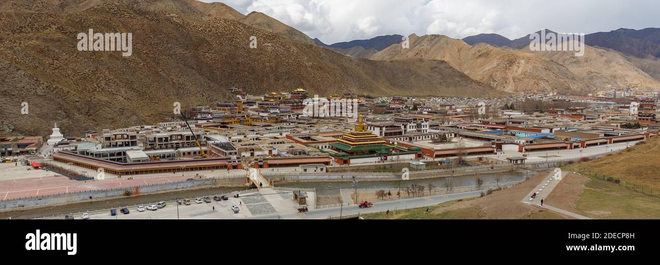 Xiahe, Gansu Province / China - April 28, 2017: Aerial view of Labrang Monastery. Largest Tibetan monastery outside of Tibet. Panorama format. Stock Photo