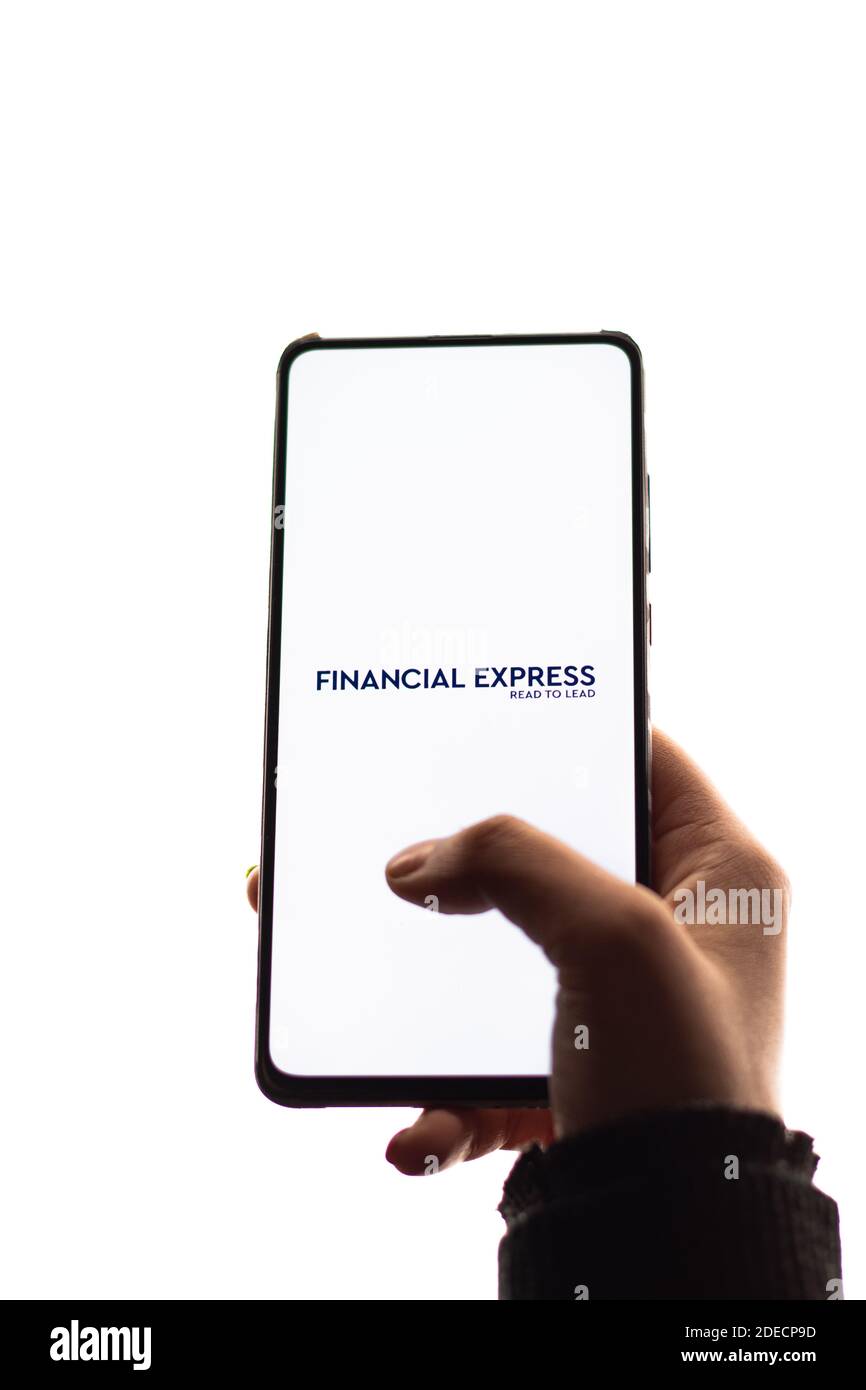 Assam, india - November 29, 2020 : Financial Express logo on phone screen stock image. Stock Photo