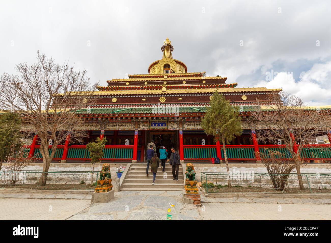 Xiahe, Gansu Province / China - April 28, 2017: Front view of Gongtang Pagoda at Labrang Monastery. Temple building with richly ornamented rooftop. Stock Photo