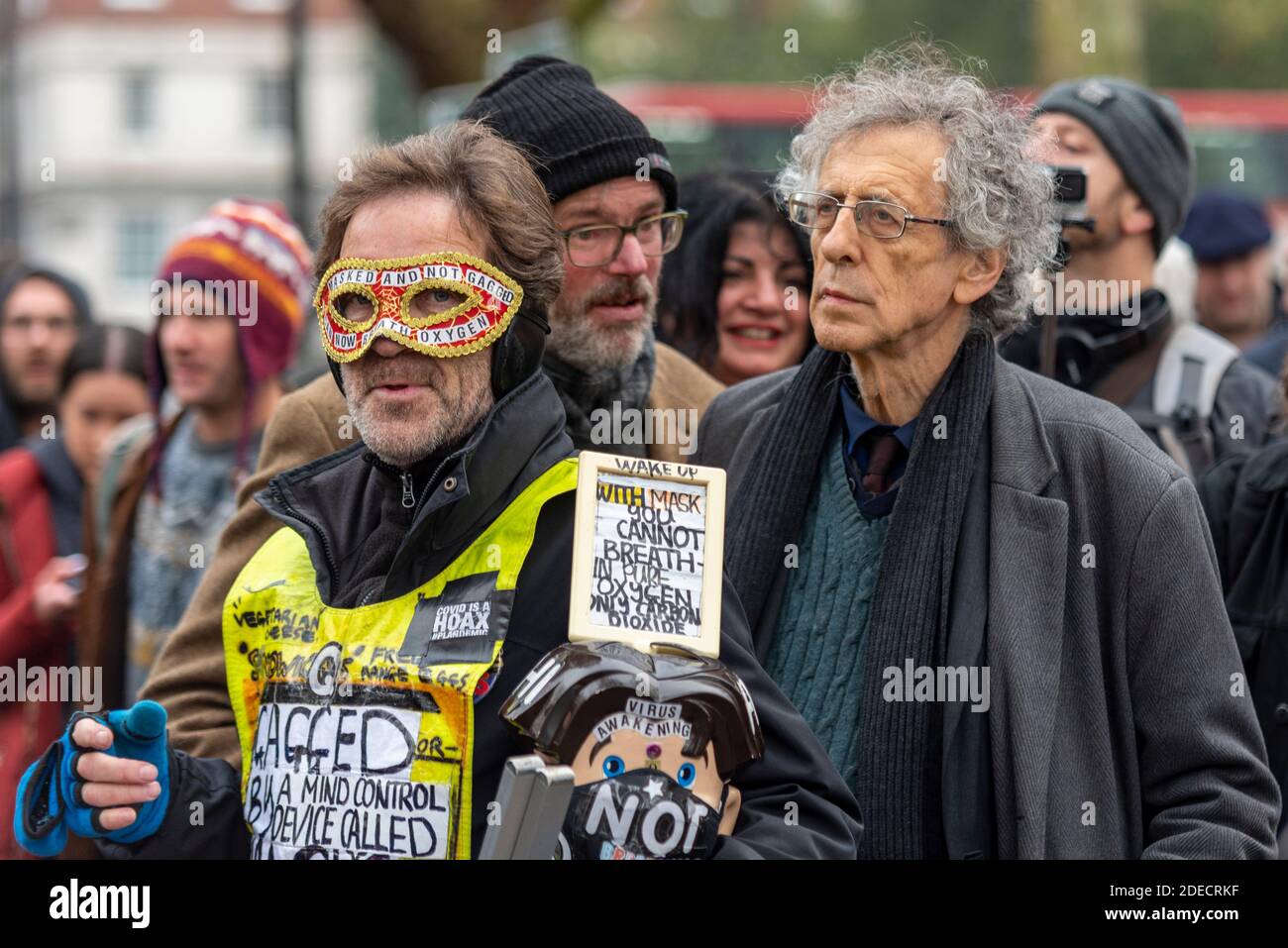 Piers Corbyn at an anti lockdown protest in London, UK, with white male in super hero mask. Corbyn was later arrested Stock Photo