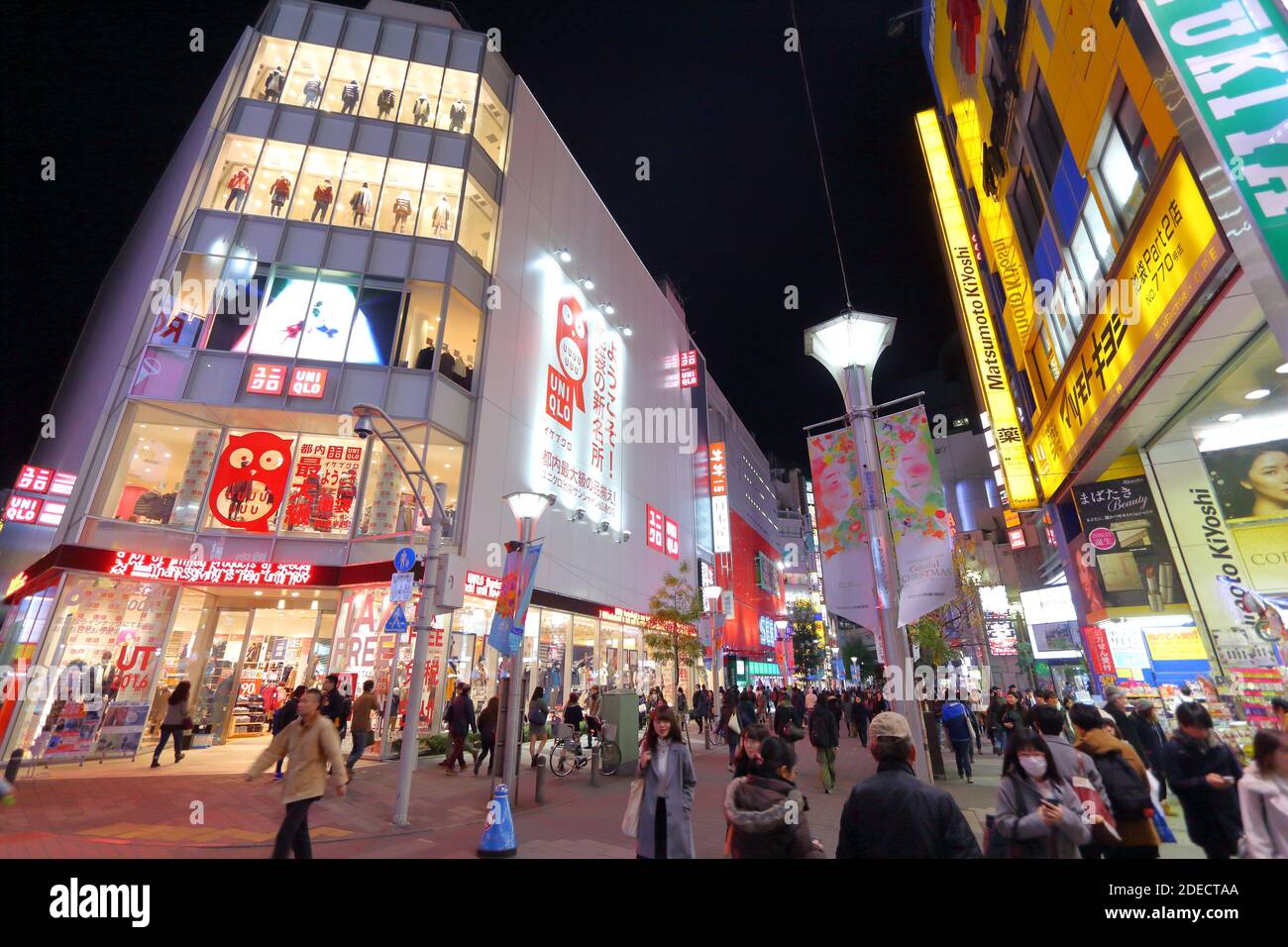 TOKYO, JAPAN - NOVEMBER 29, 2016: People shop atTokyo city Ikebukuro district at night. Tokyo is the capital city of Japan. 37.8 million people live i Stock Photo