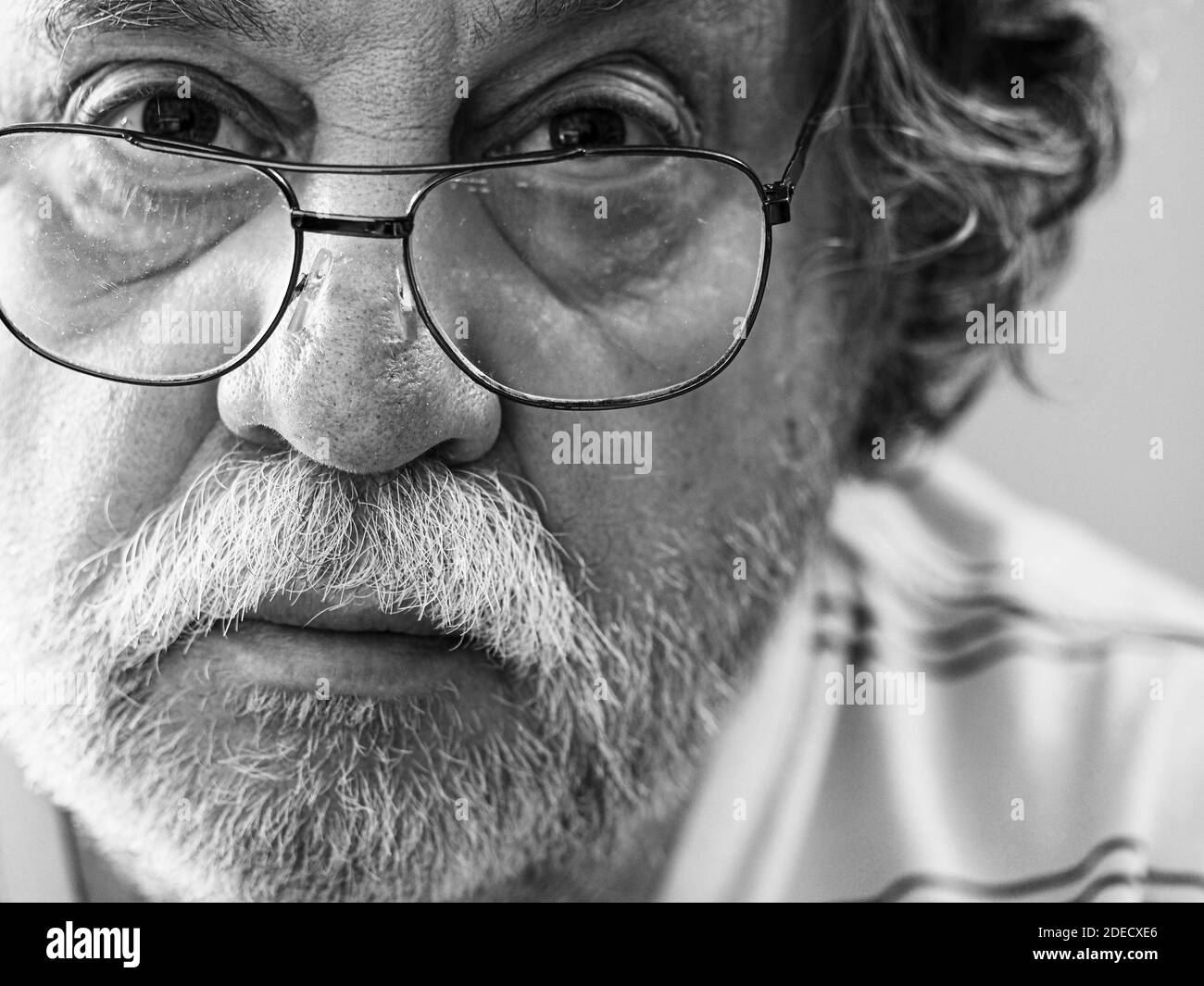 Black and white portrait of Caucasian middle-aged man with a mustache and a beard on his face Stock Photo