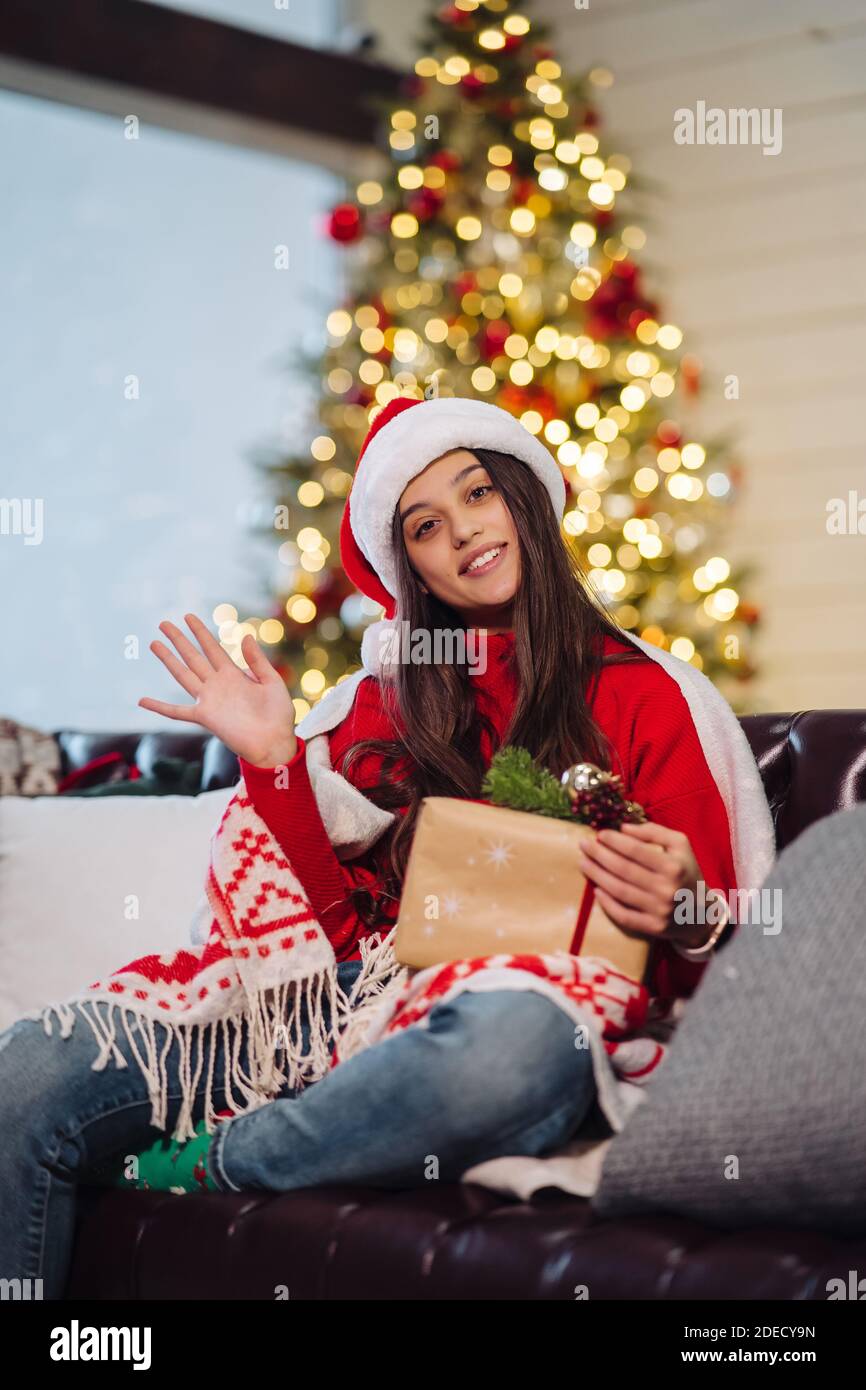 Girl holding a Christmas present on New Years Eve Stock Photo - Alamy