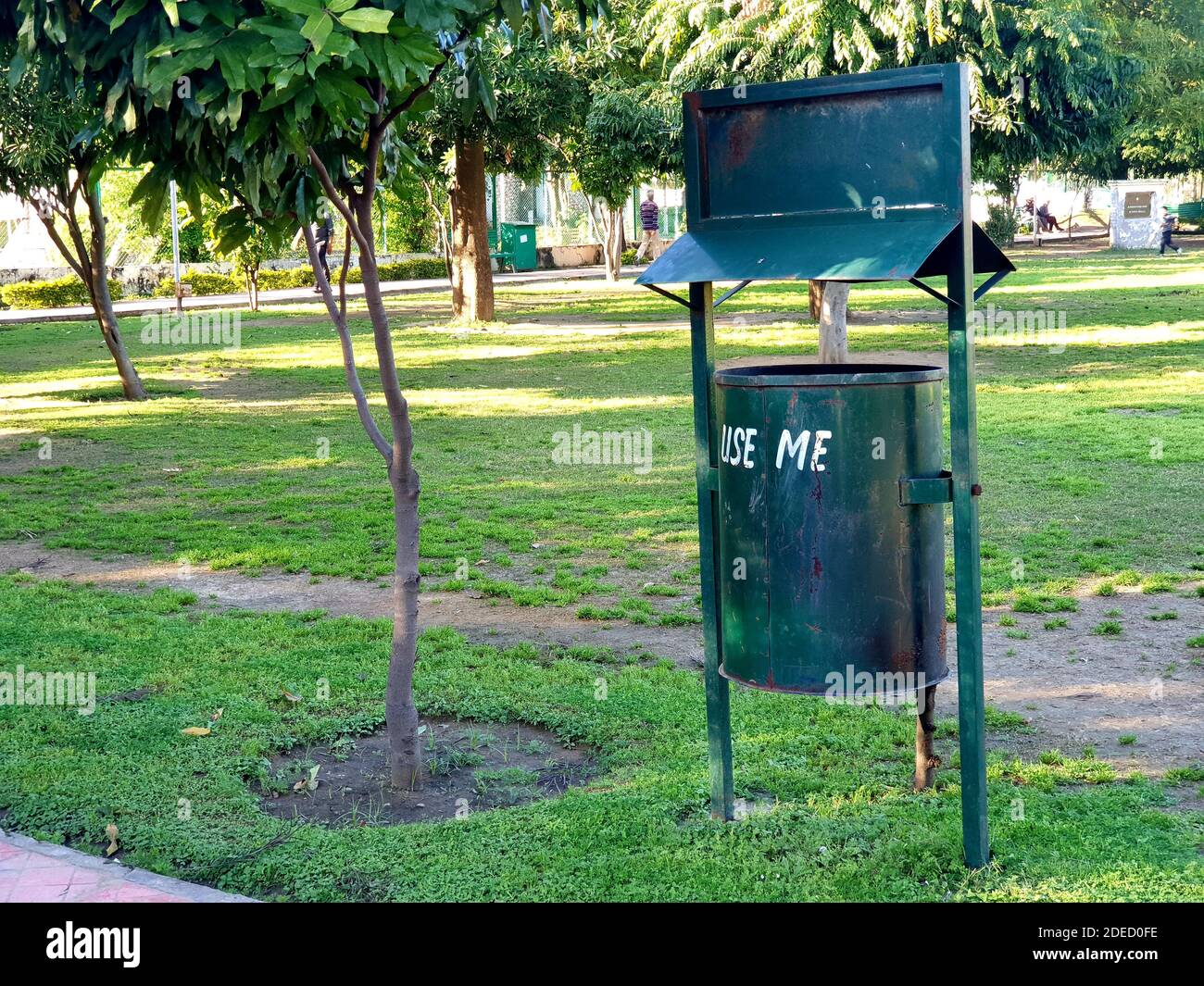 03 june 2020 Use me dustbin in public park green color iron plants also seems Stock Photo