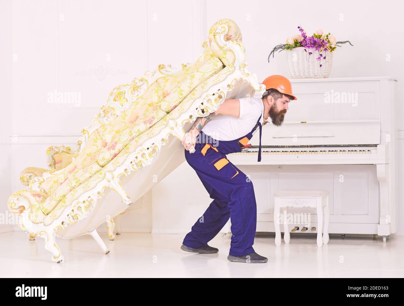 Relocation concept. Courier delivers furniture in case of move out