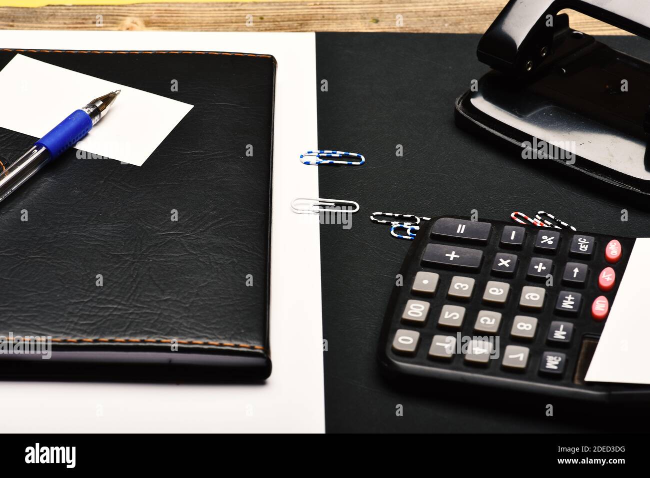 Office tools isolated on black and white background. Calculator, hole