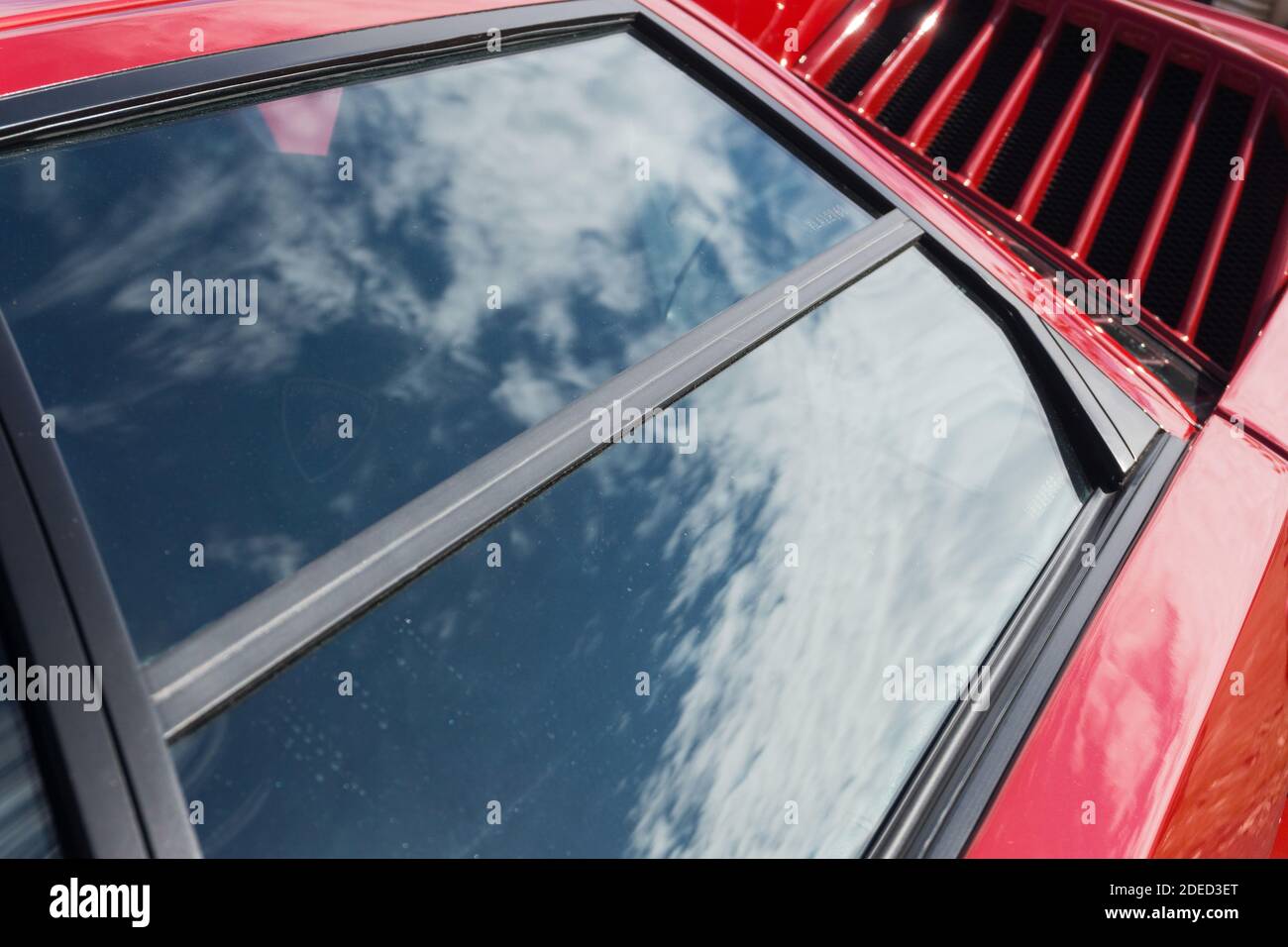 Close up detail of the right side door and window of a red Lamborghini Countach 25th Anniversary Edition, showing the fin strakes on the intake ducts Stock Photo