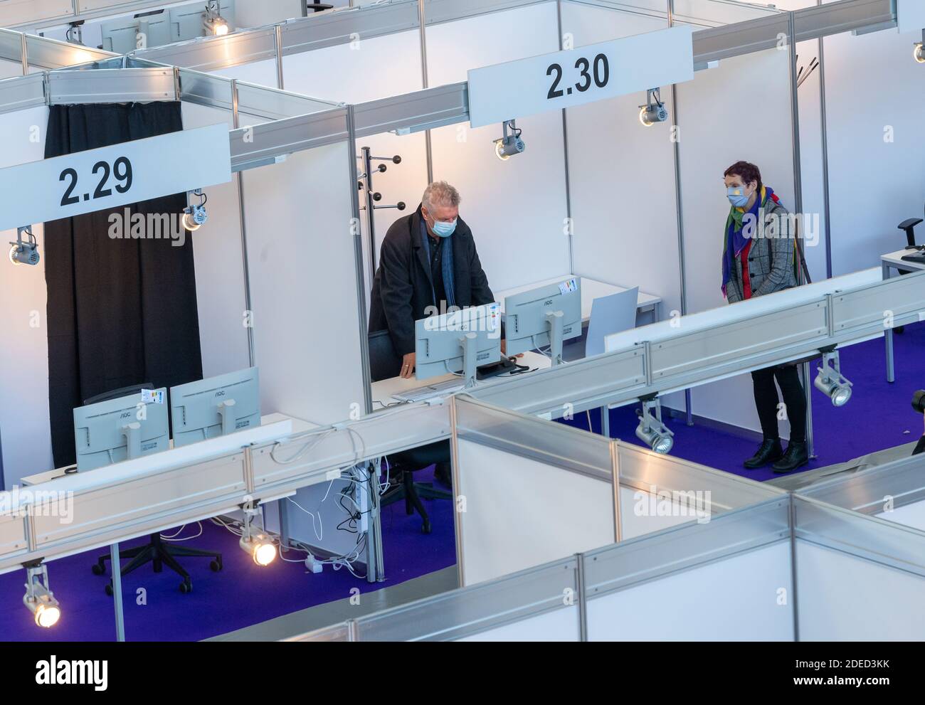 Munich, Germany. 30th Nov, 2020. Dieter Reiter (l), Lord Mayor of Munich and Beatrix Zurek (r), Health Officer of the City of Munich, visit the Contact Tracing Center that was set up at Messe Riem. Credit: Peter Kneffel/dpa/Alamy Live News Stock Photo