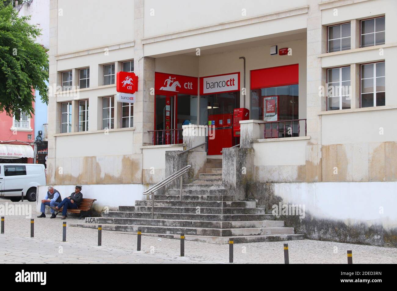 NAZARE, PORTUGAL - MAY 22, 2018: People sit in front of CTT Correios de  Portugal (national postal service) and Banco CTT (banking and financial  servic Stock Photo - Alamy