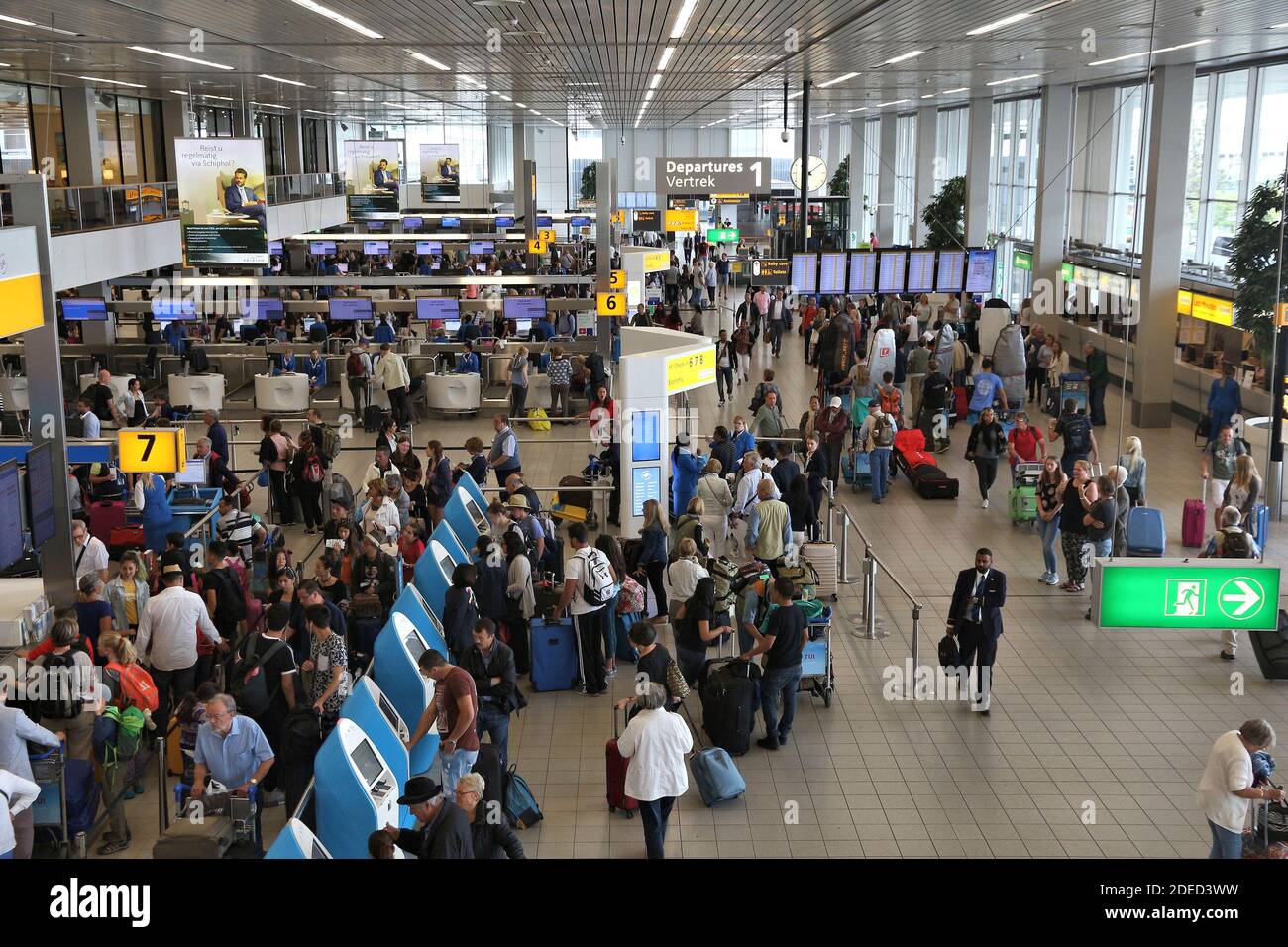 AMSTERDAM, NETHERLANDS - JULY 11, 2017: Travelers visit Schiphol Airport in Amsterdam. Schiphol is the 12th busiest airport in the world with more tha Stock Photo