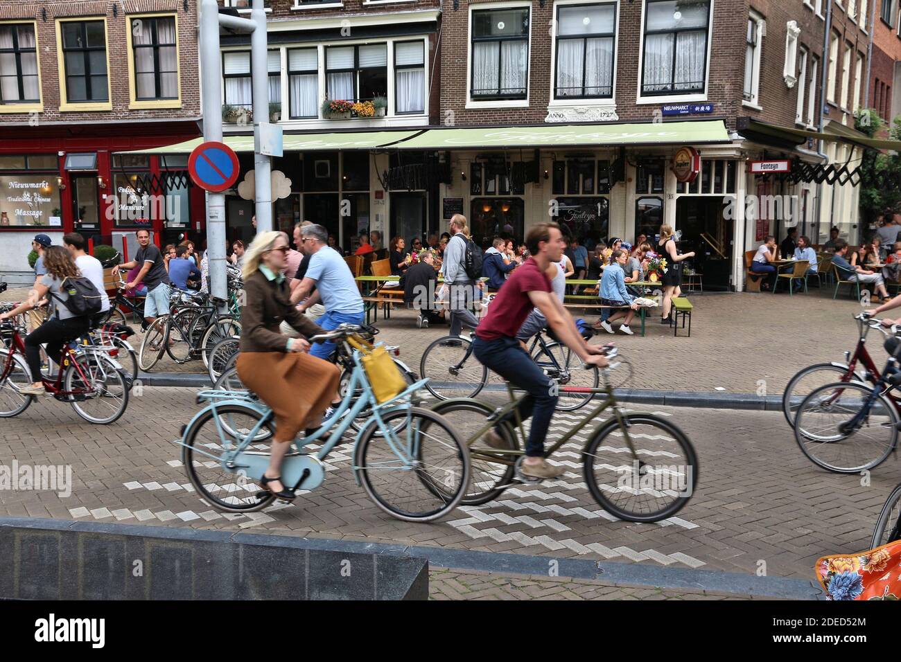 AMSTERDAM, NETHERLANDS - JULY 8, 2017: People visit Nieuwmarkt square in Amsterdam, Netherlands. Amsterdam is the capital city of The Netherlands. Stock Photo