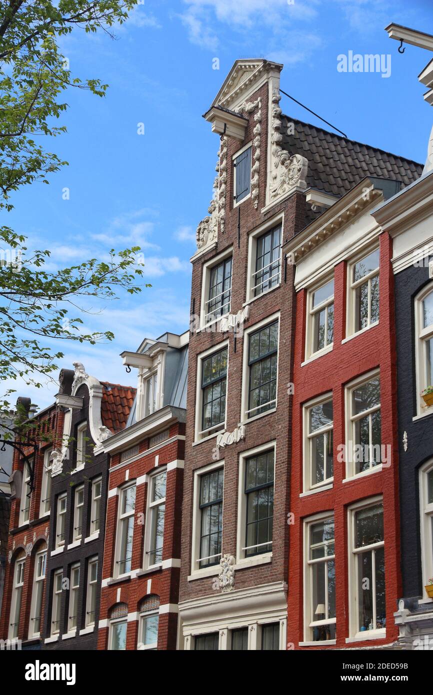 Amsterdam old city architecture - Oudezijs Voorburgwal residential buildings. Netherlands rowhouse. Stock Photo