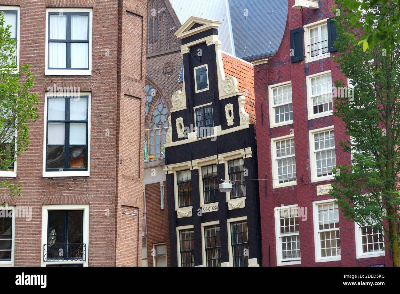 Amsterdam city architecture - crooked residential buildings. Netherlands rowhouse. Stock Photo