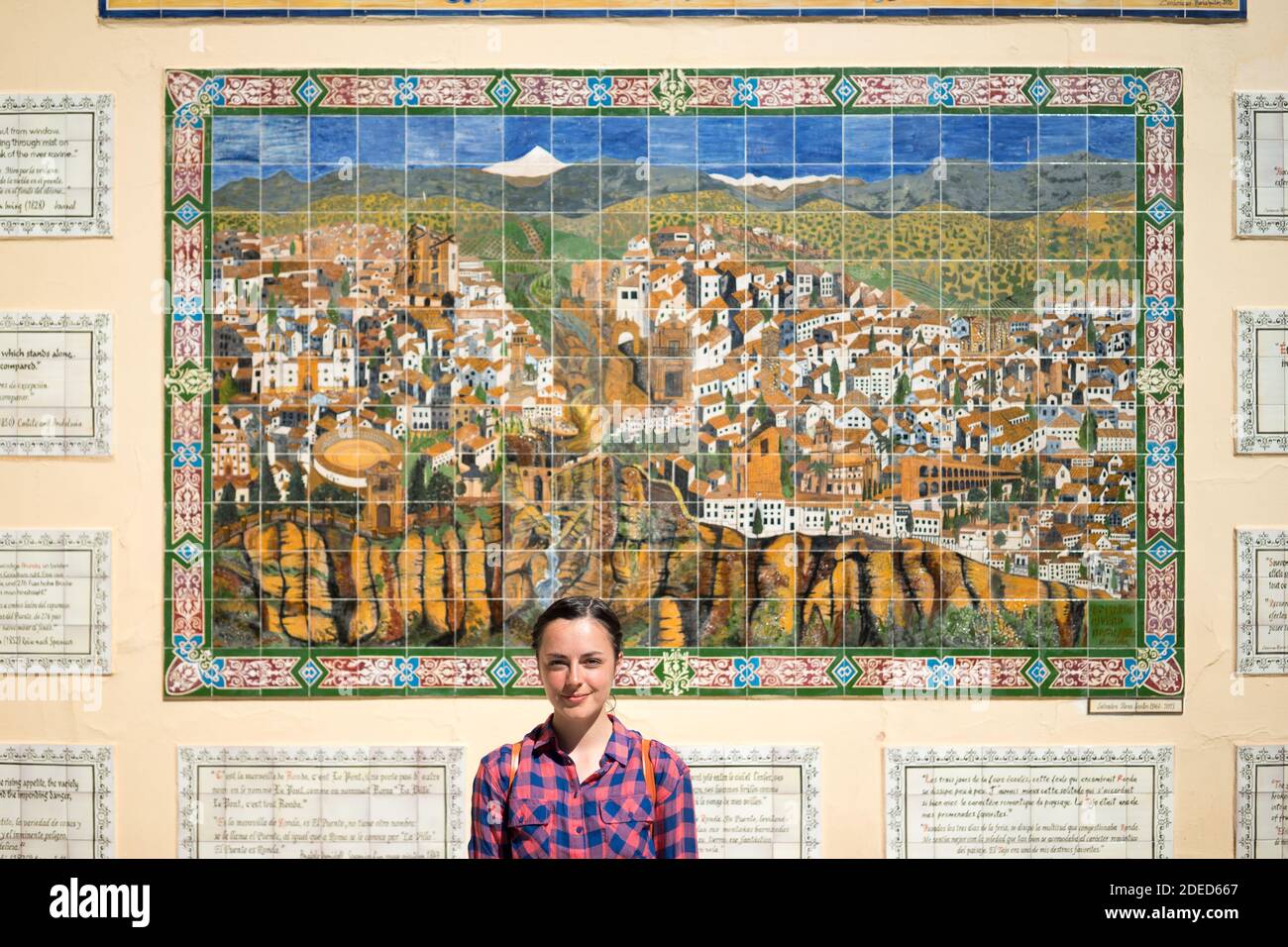 Woman in front mosaic map of Ronda, Andalusia, Spain Stock Photo