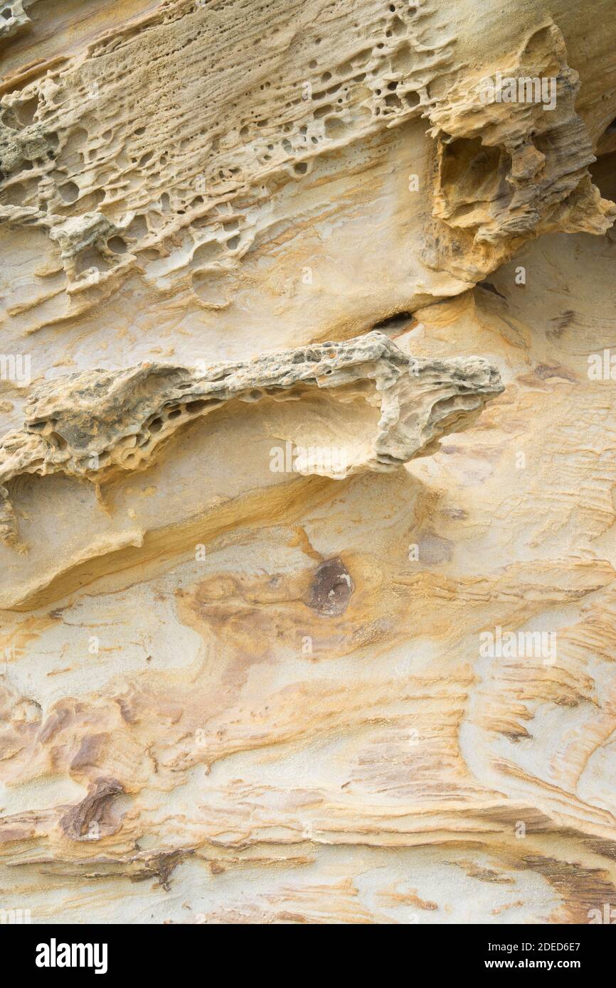 Sand and rock texture on the beach Stock Photo