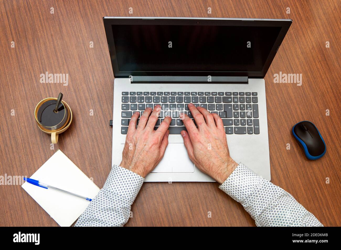 man hands typing on computer seen from above, at home or office table ...