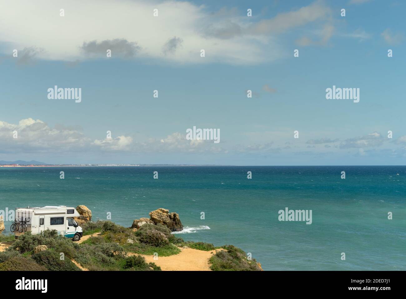Camper van parked on a beach Stock Photo - Alamy