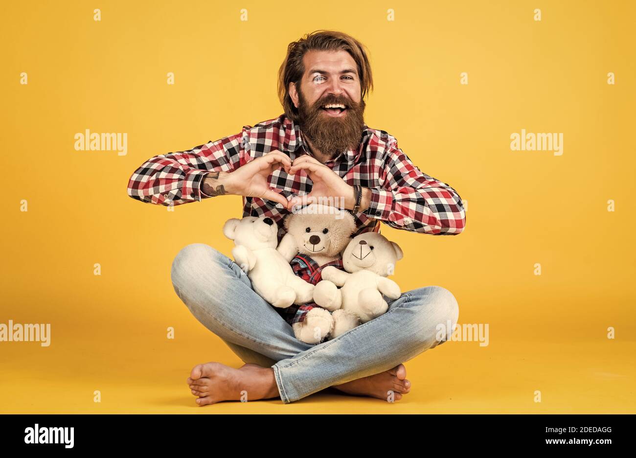 my heart is yours. Man with beard hold cute toy bear. Man holds teddy bear. Gifts and holidays concept. This is for you. hipster like animal toy. Birthday holiday party celebration. feel happiness. Stock Photo