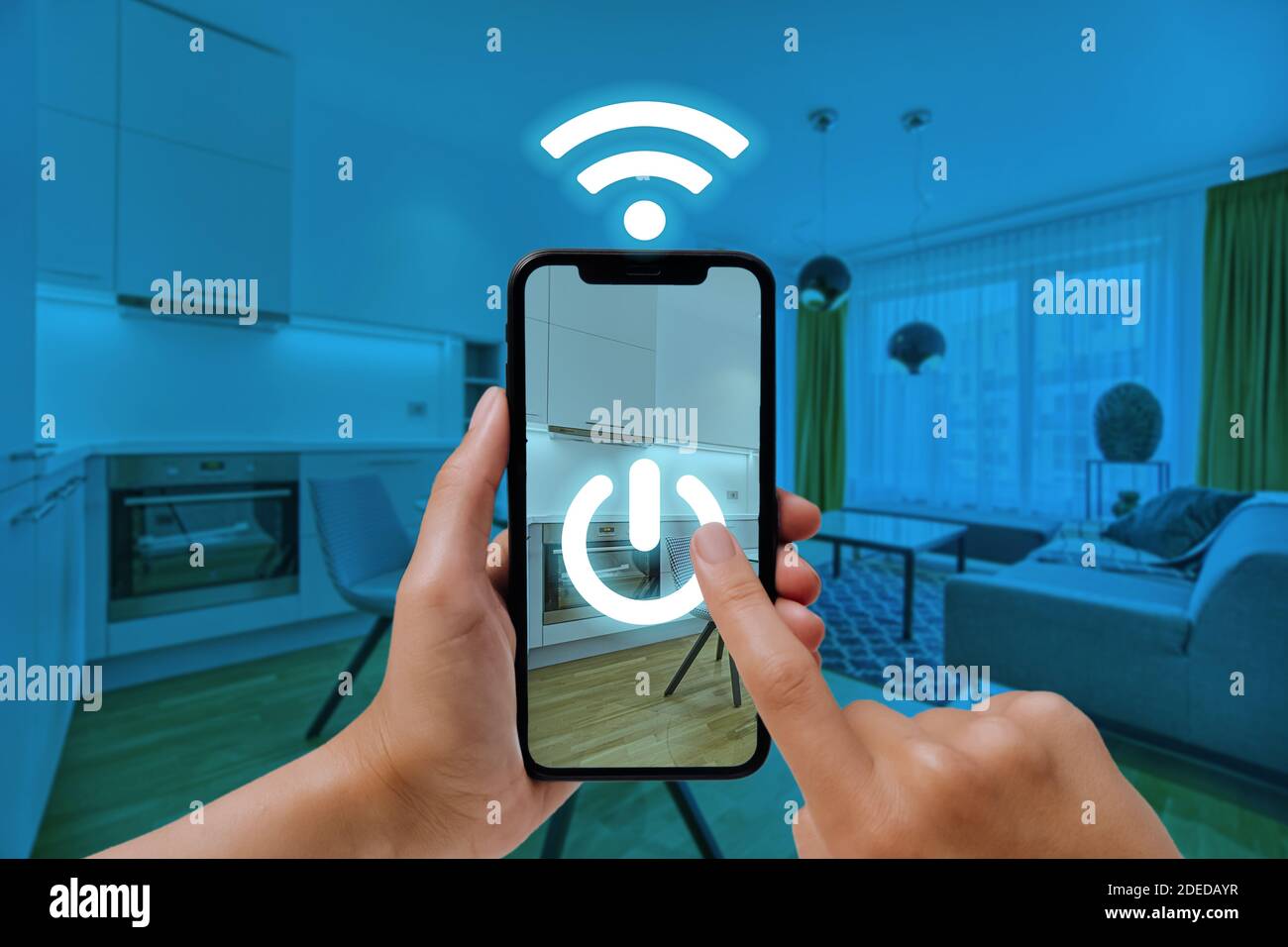 Concept on home automation. A woman uses a smartphone to control