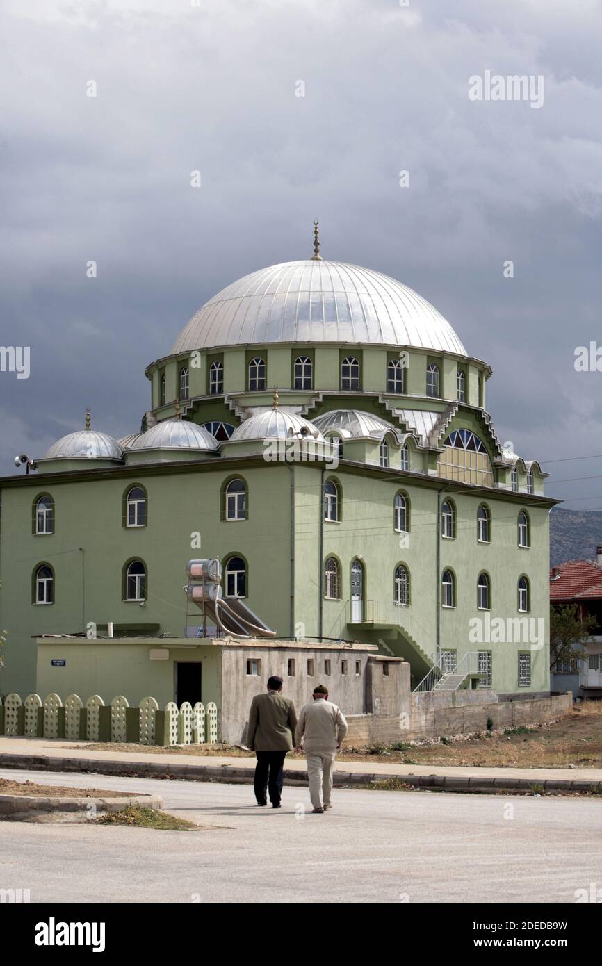 Two men on the way to the mosque in Anatolia Stock Photo