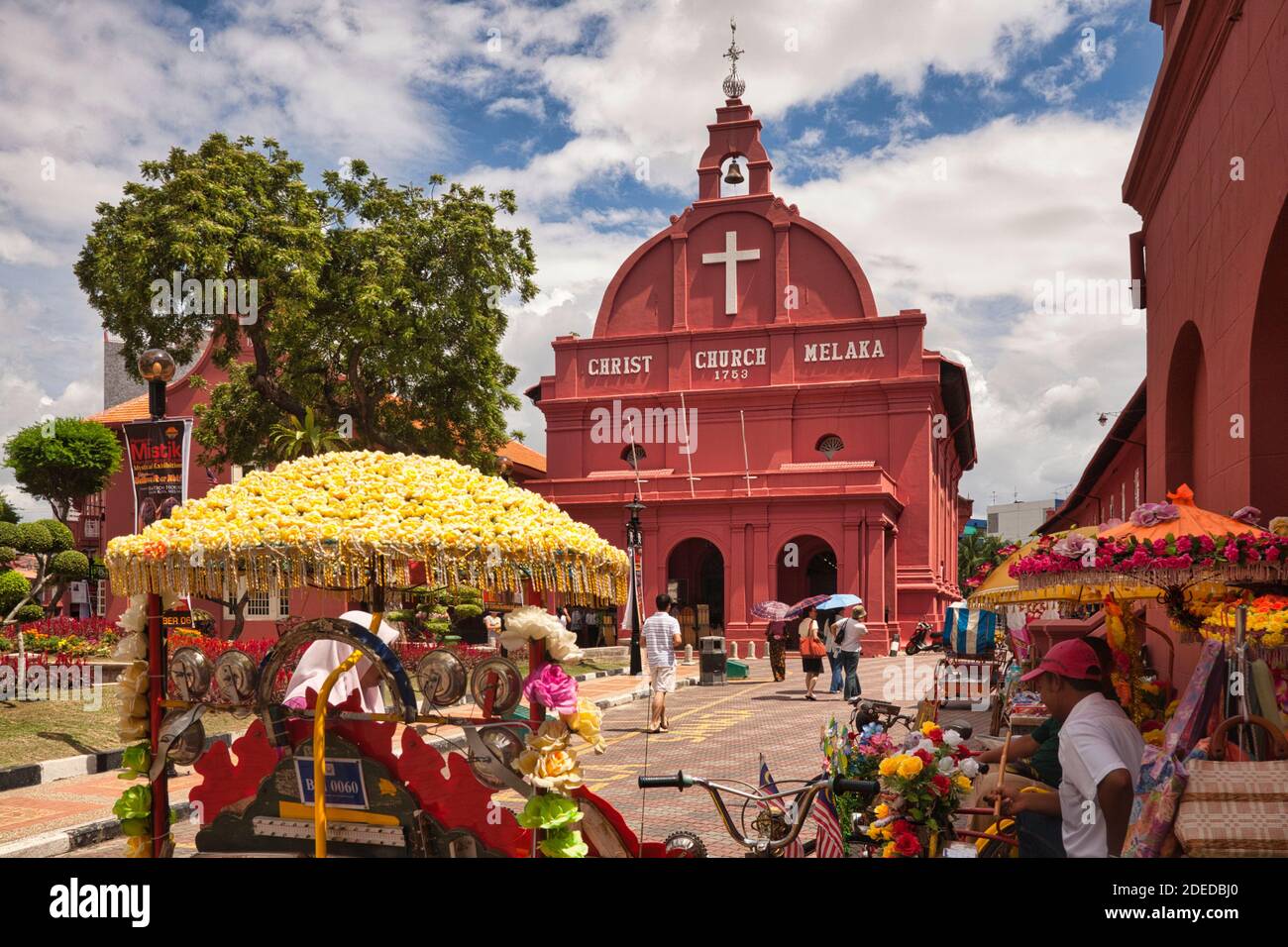 The main Church in Malacca with colourful decorative pedal trishaws on the road in front. Malacca, Malaysia Stock Photo