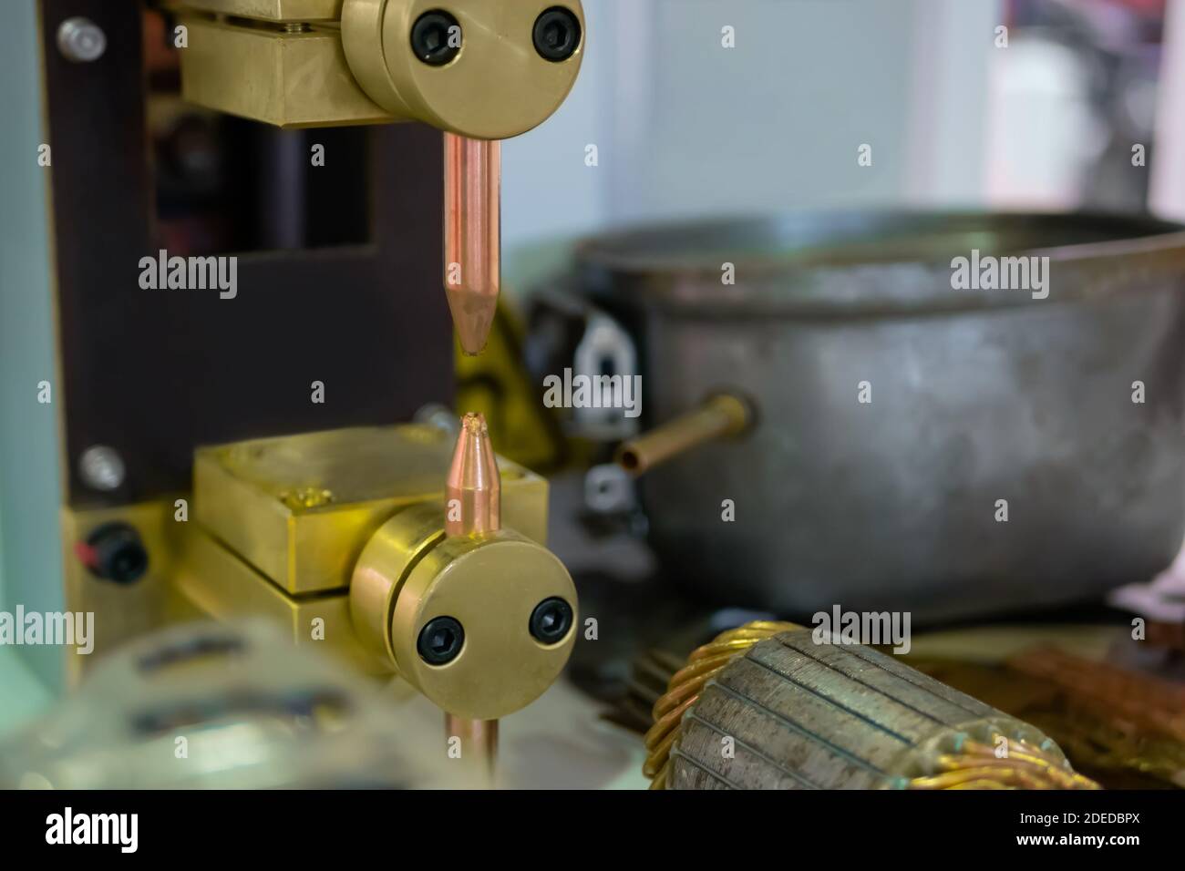 Copper electrodes of spot welding machine at factory, plant close up