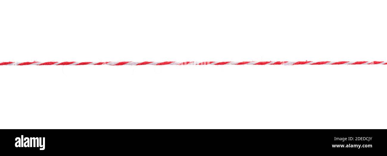 Long straight red and white twisted rope isolated on white Stock