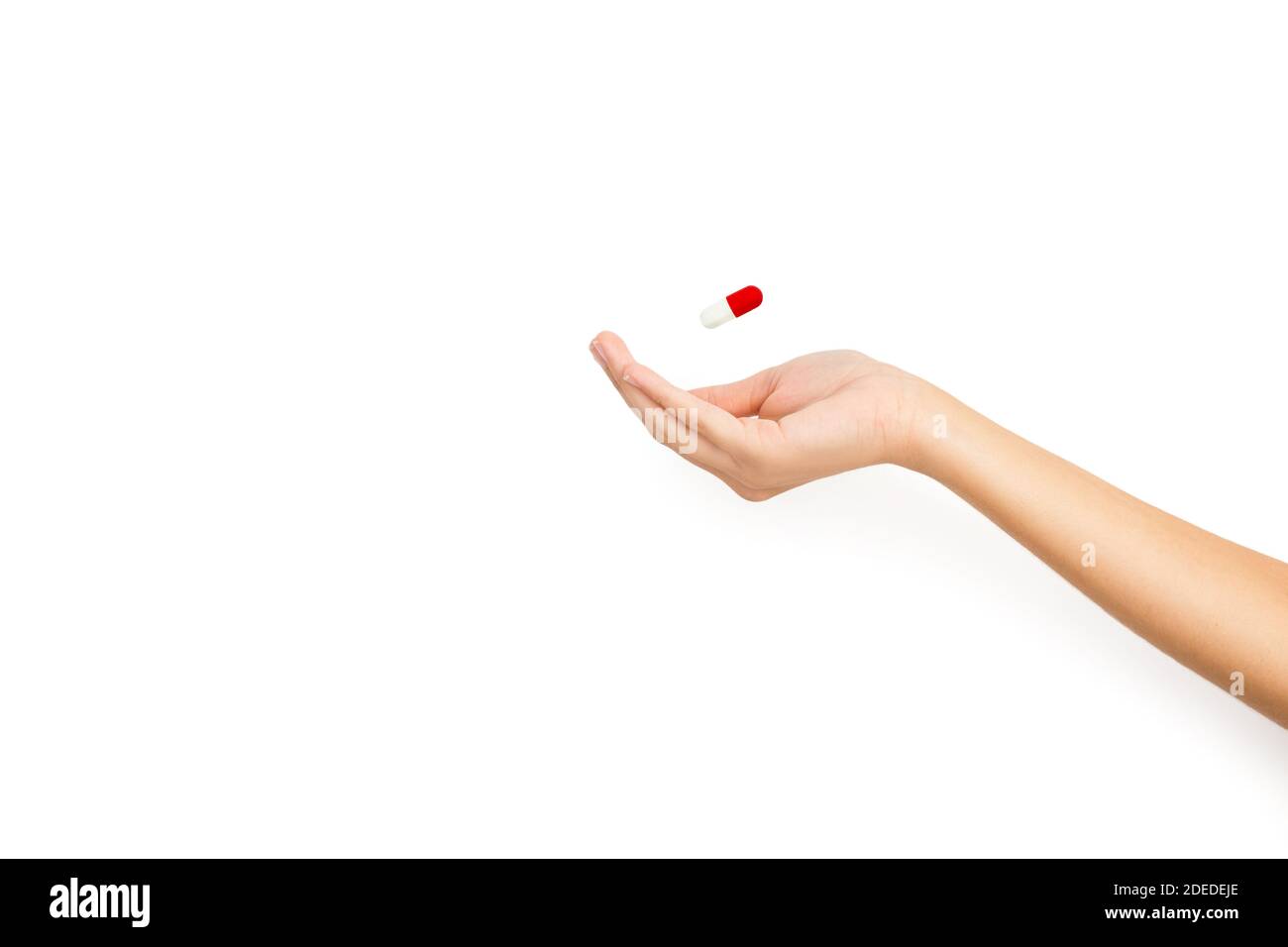 Woman hand with a medical capsule isolated on a white background Stock Photo
