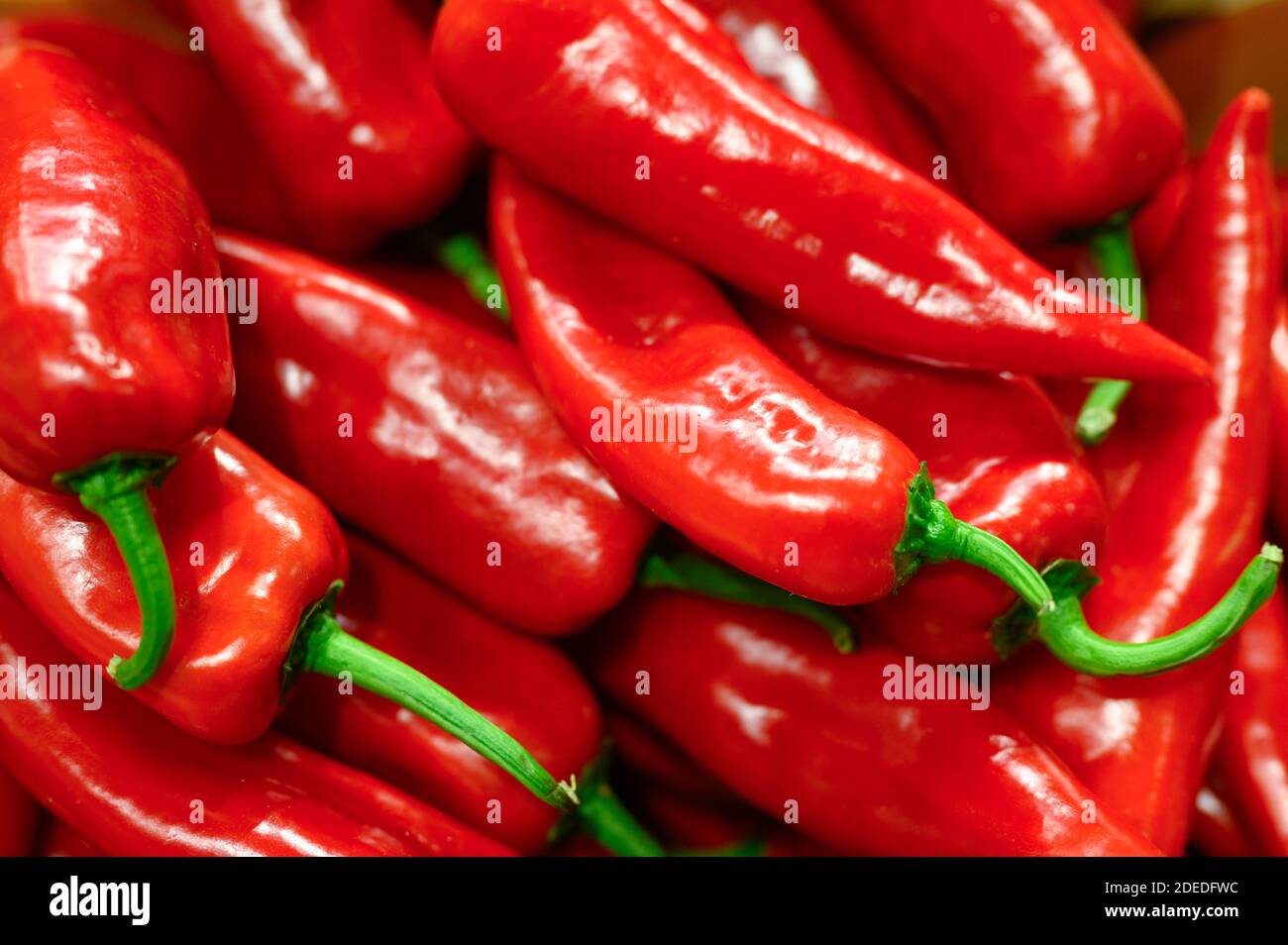 a pile of vegetables red hot chili peppers as background Stock Photo ...