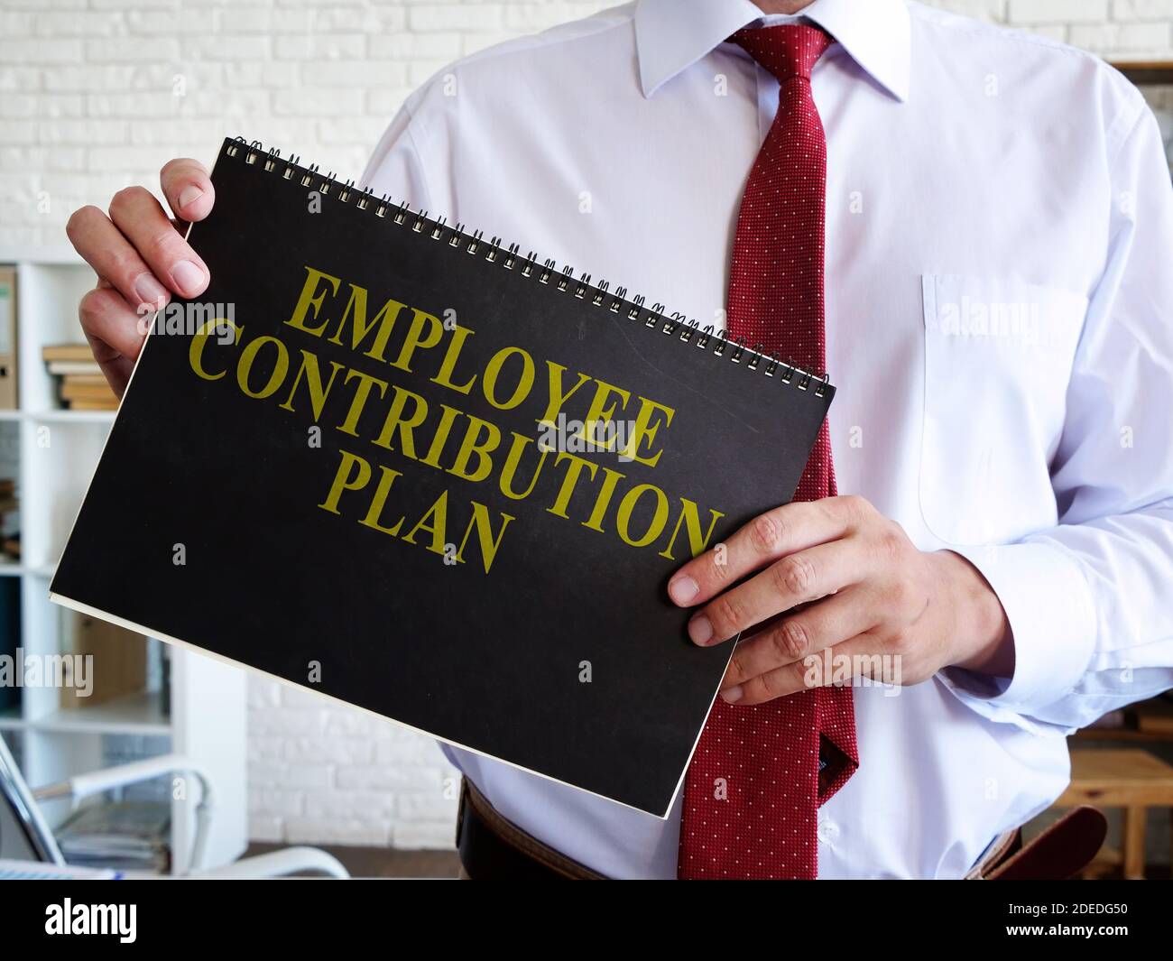 Manager proposes Employee Contribution Plan for reading. Stock Photo