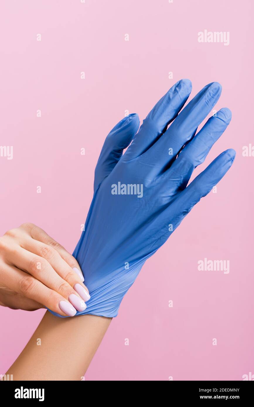 Person putting on blue latex hi-res stock photography and images - Alamy
