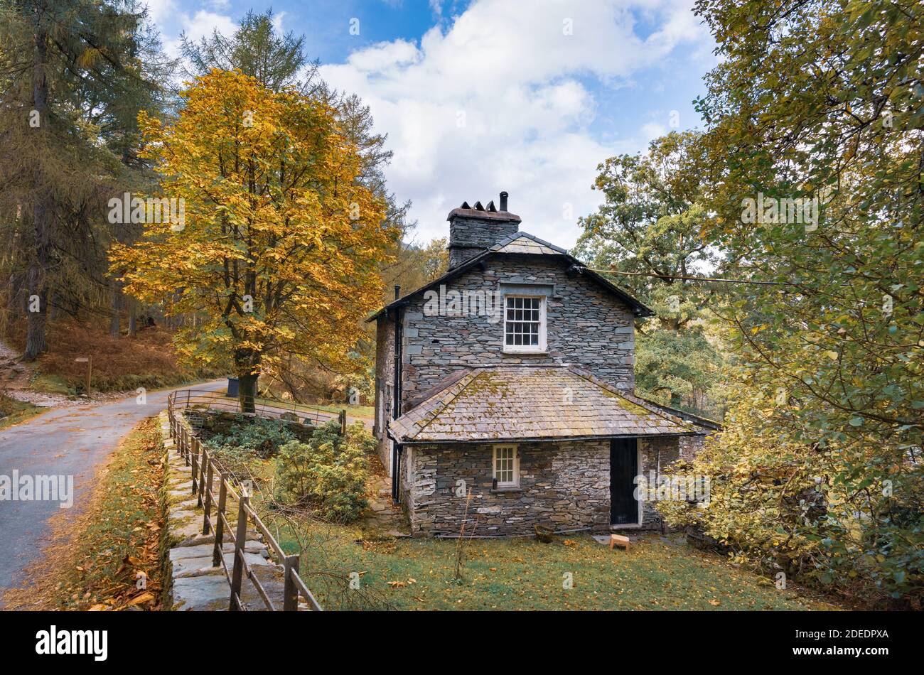 Slate stone house by roadside in Sawrey's Wood Great Langdale in English Lake District Cumbria Stock Photo