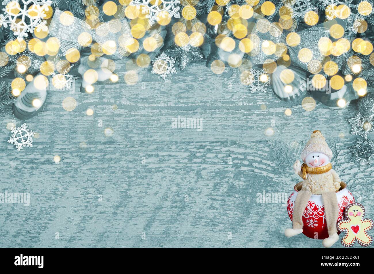 Christmas tinted background with bokeh . Funny toy snowman Stock Photo
