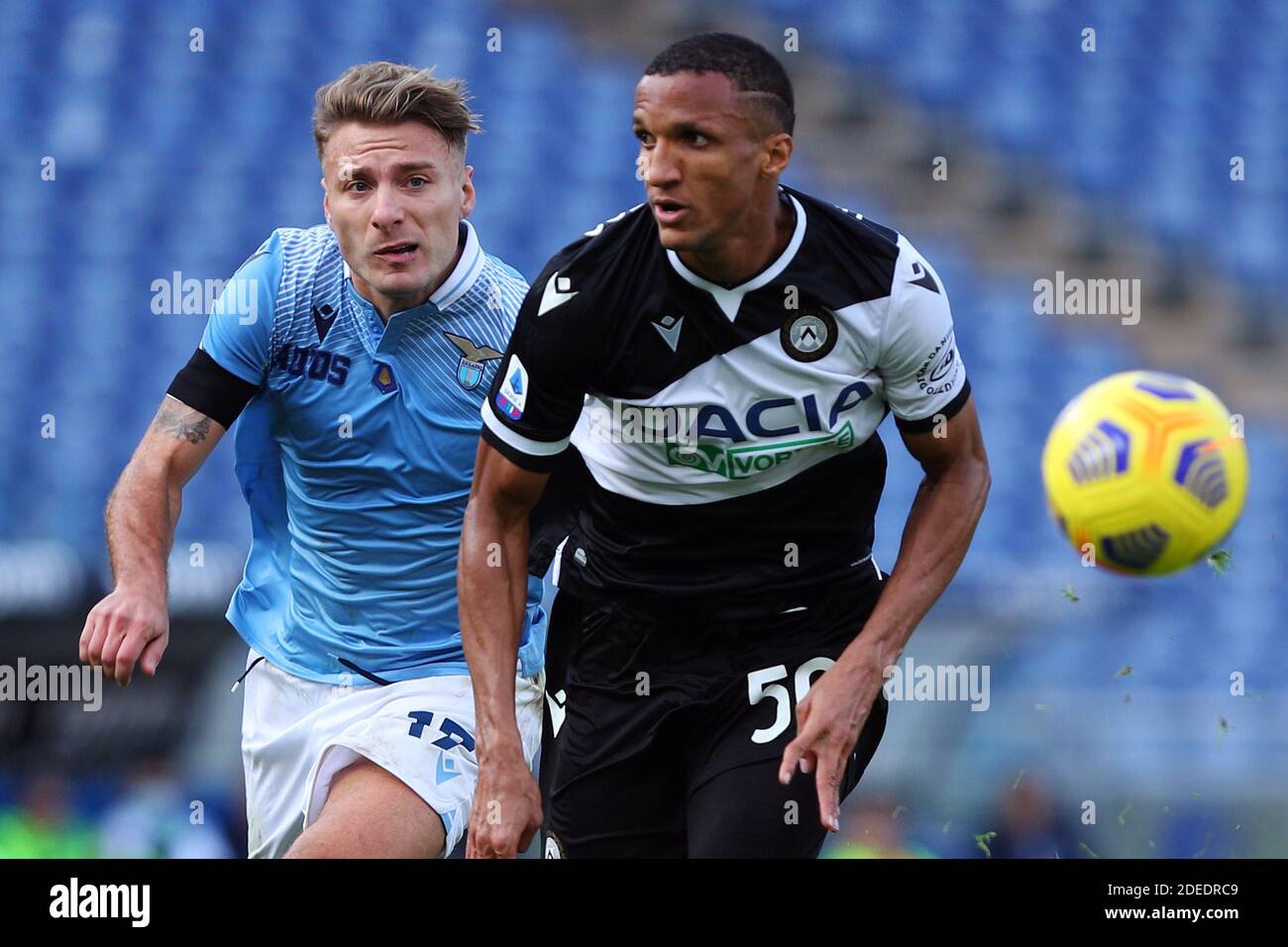 Ciro Immobile of Lazio (L) vies for the ball with Rodrigo Becao of Udinese (R) during the Italian championship Serie A foot / LM Stock Photo