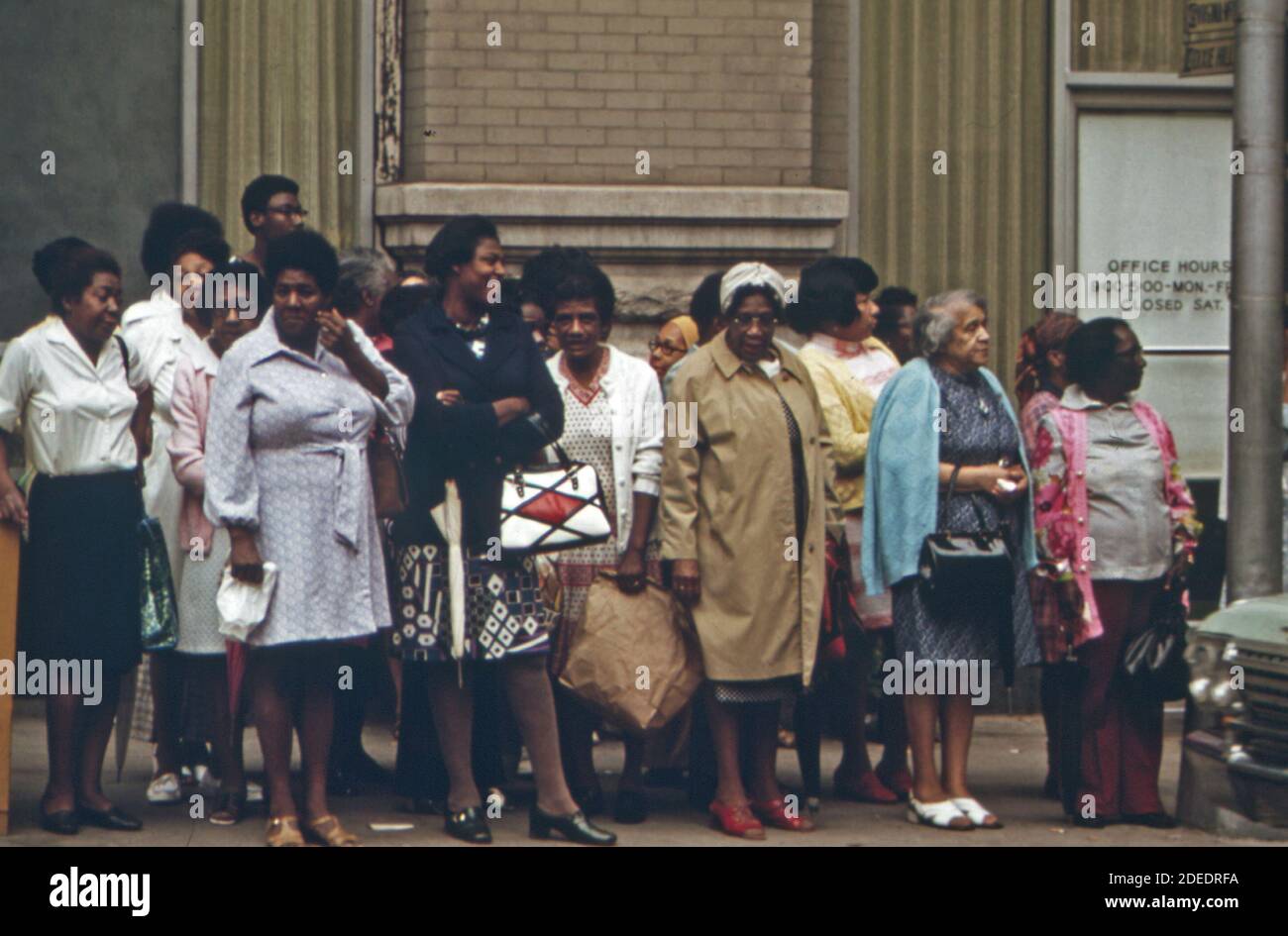 Group of passengers waiting for a Metropolitan Atlanta Rapid Transit Authority (MARTA) bus in Atlanta; Georgia.  ca. 1974 Stock Photo