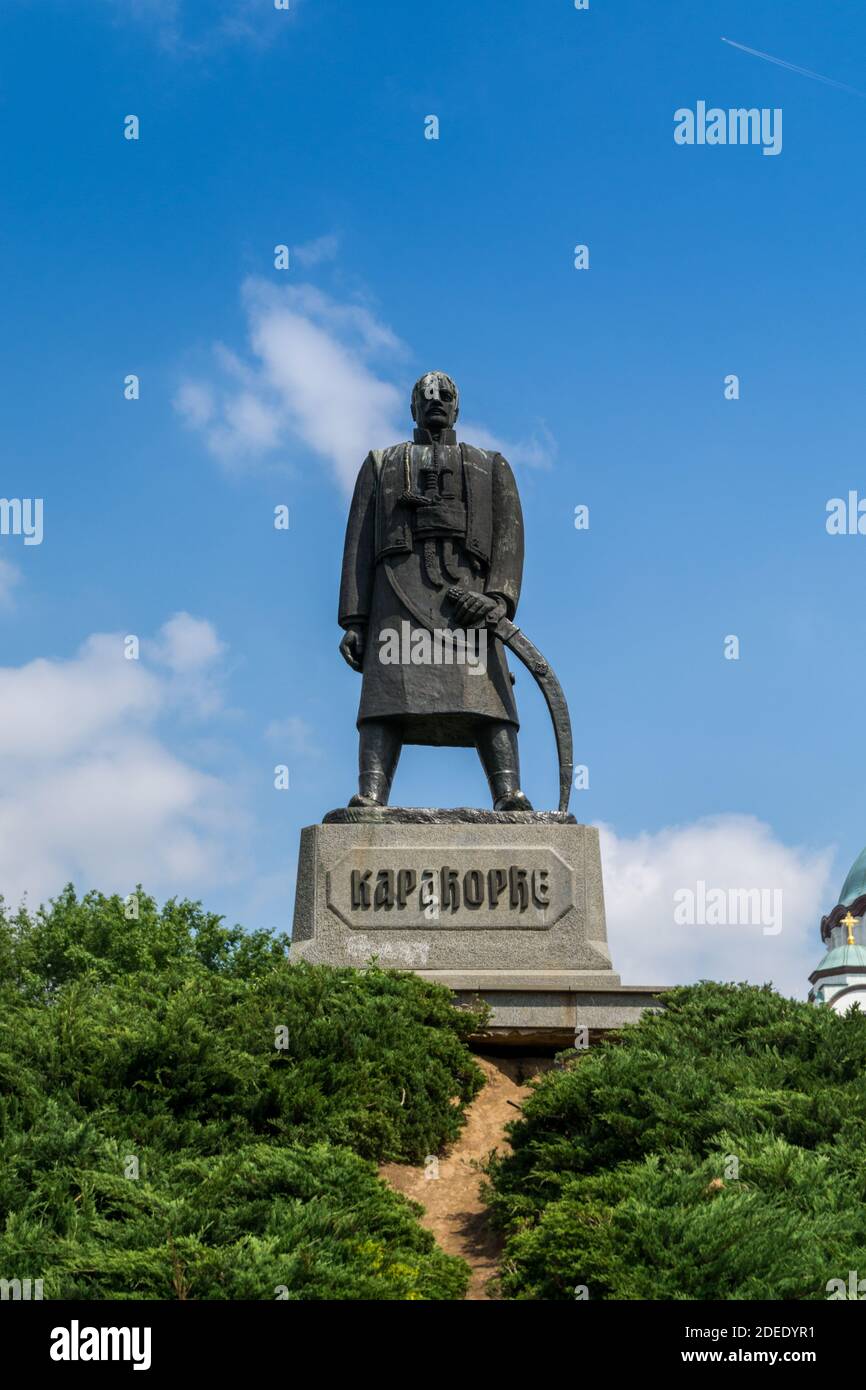 Karadjordje statue against blue sky  and church of Saint Sava, a Serbian Orthodox church located in Belgrade, Serbia Stock Photo