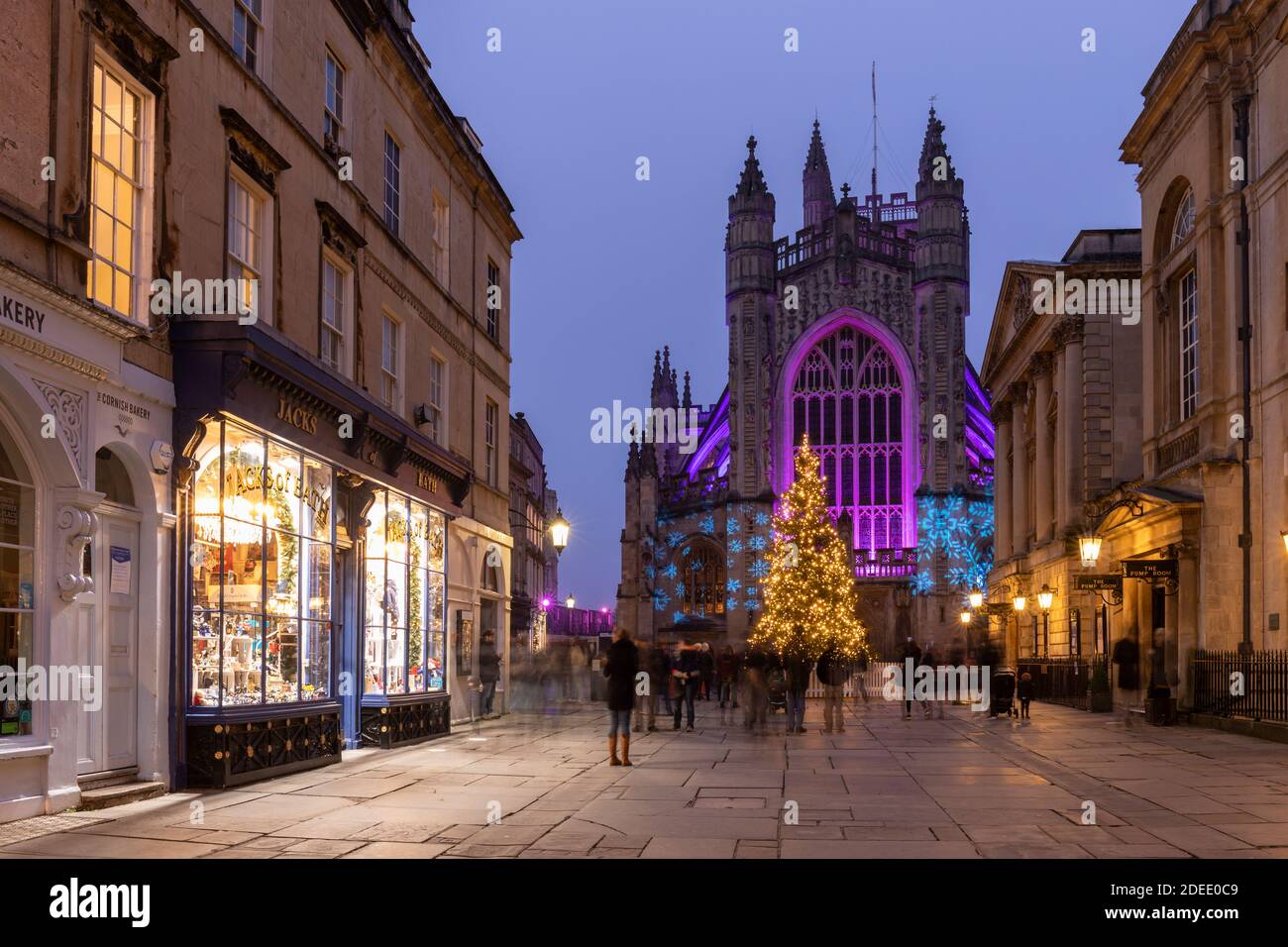 Bath Abbey lit with colourful illuminations and a bright tall Christmas ...